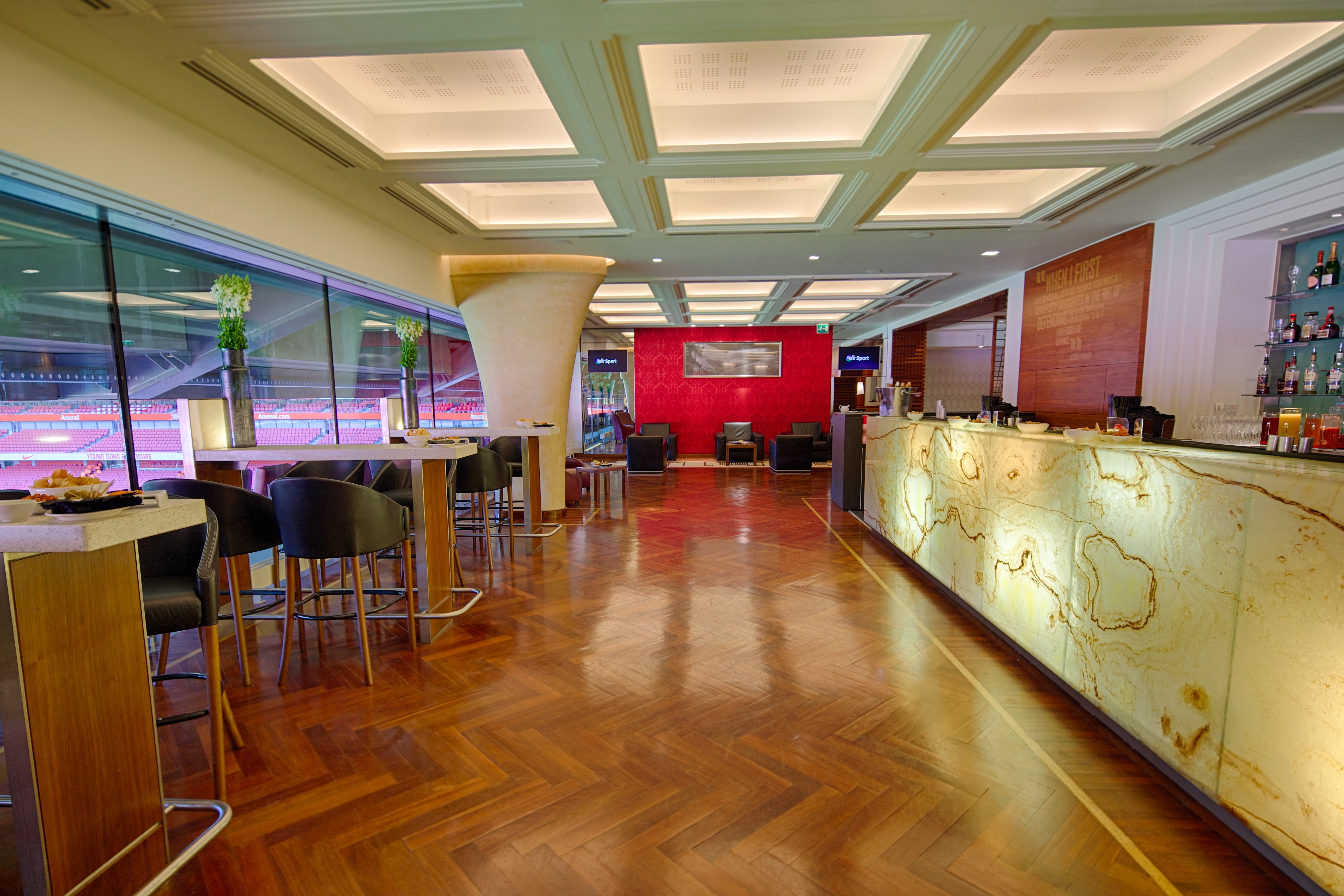 Diamond Club at Emirates Stadium: modern event space with elegant wood flooring, ideal for gatherings.