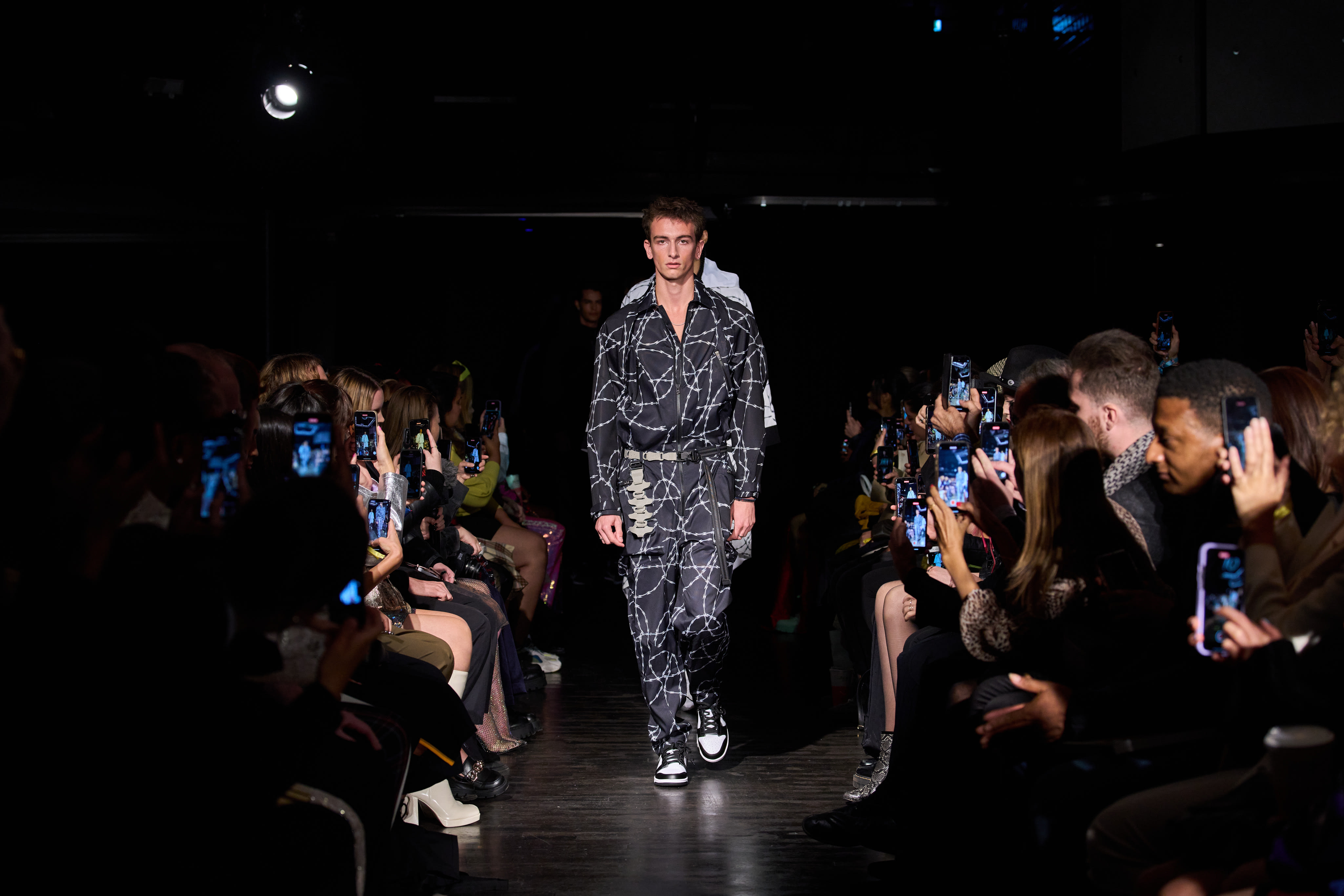 Fashion runway at Ministry of Sound with dynamic lighting and engaged audience.