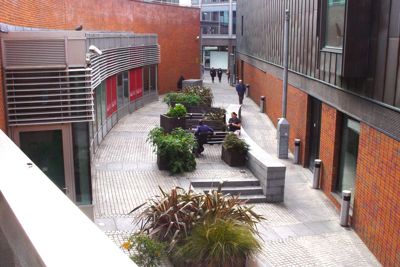"Outdoor networking space at Liverpool Quaker Meeting House with seating for events."
