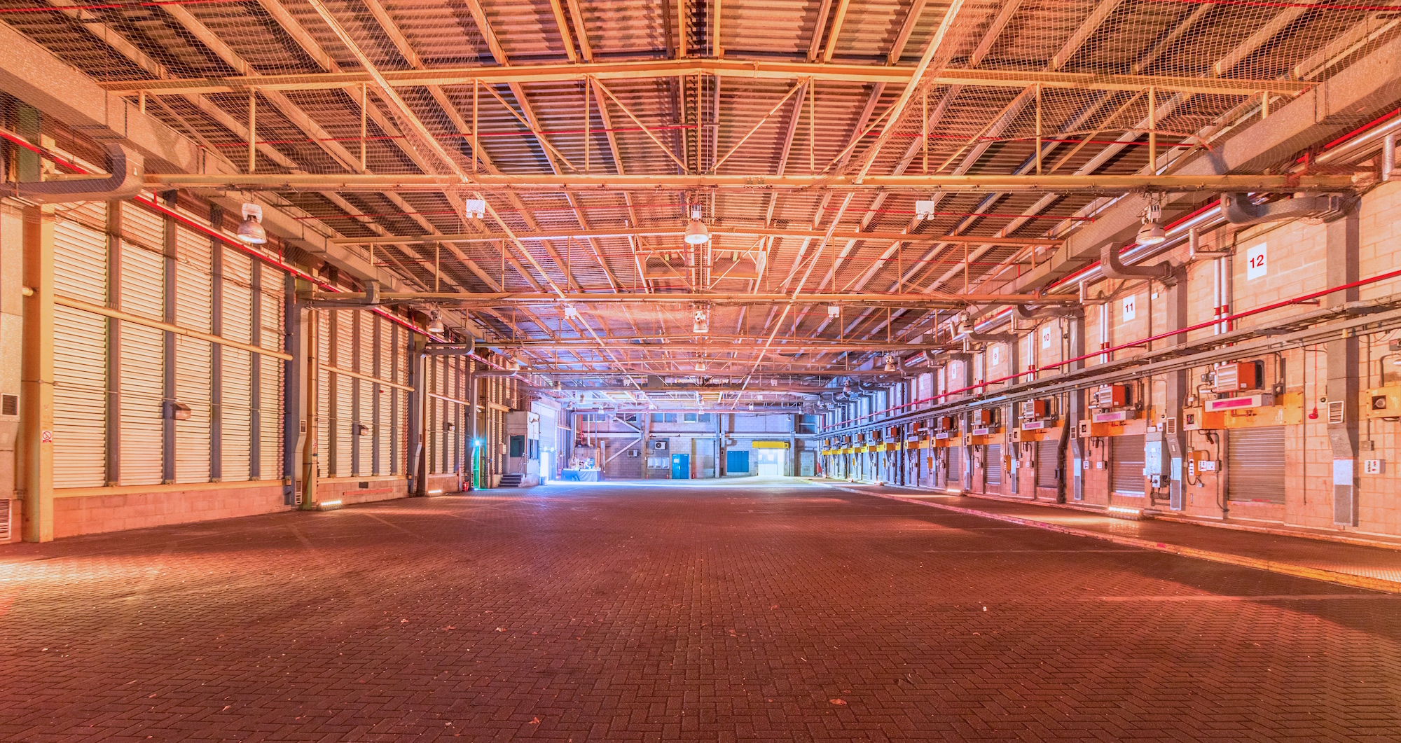 Spacious industrial venue with high ceilings for corporate events and exhibitions in London.