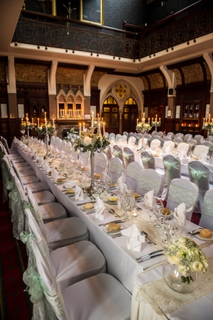 Elegant banquet hall with white linens, perfect for weddings and corporate events.