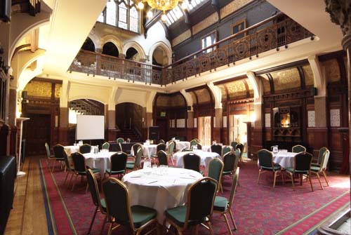 Main Hall at Highbury Hall with round tables, perfect for meetings and banquets.