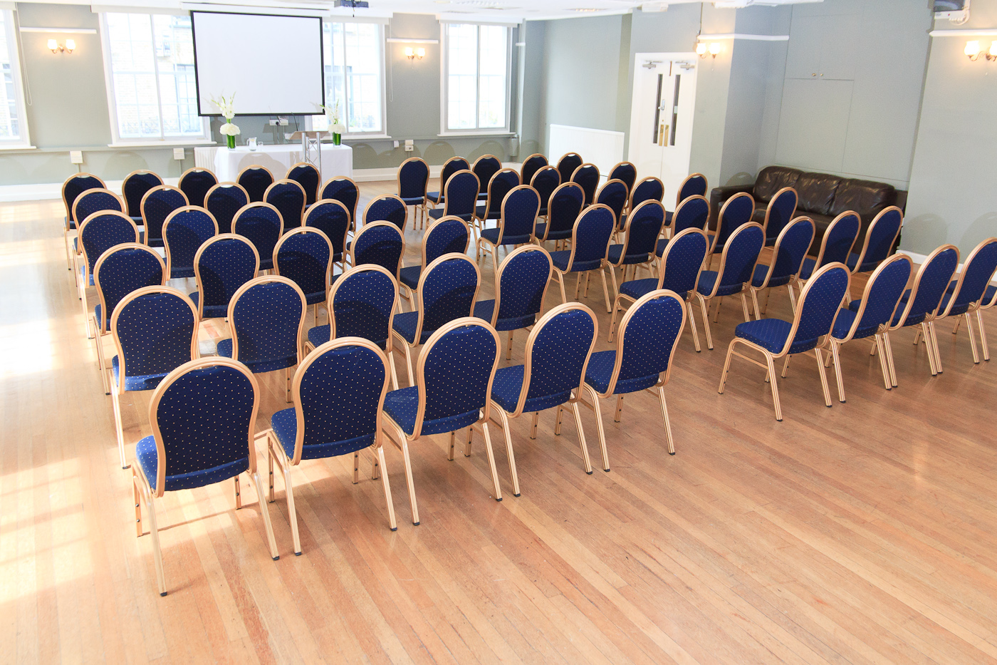 Presidential Suite at The London Irish Centre, blue chairs for meetings and presentations.