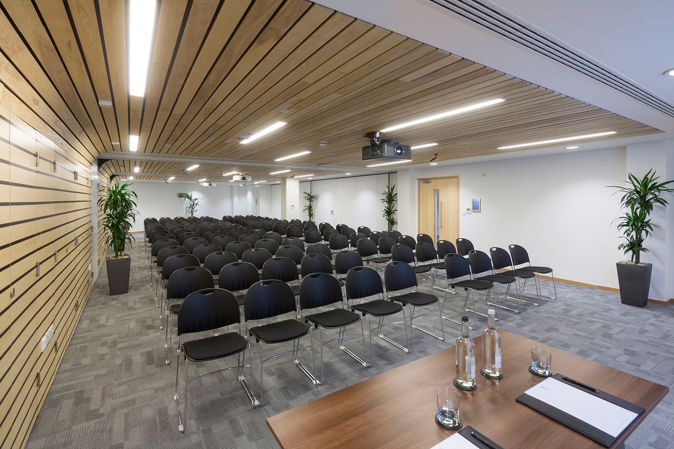 Nightingale Suite conference room with black chairs, ideal for seminars and events.