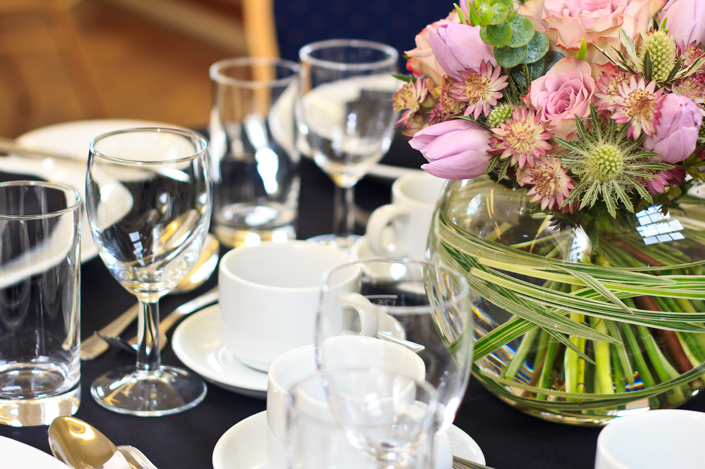 Chapel Suite dining table with fresh flowers for corporate events and elegant gatherings.