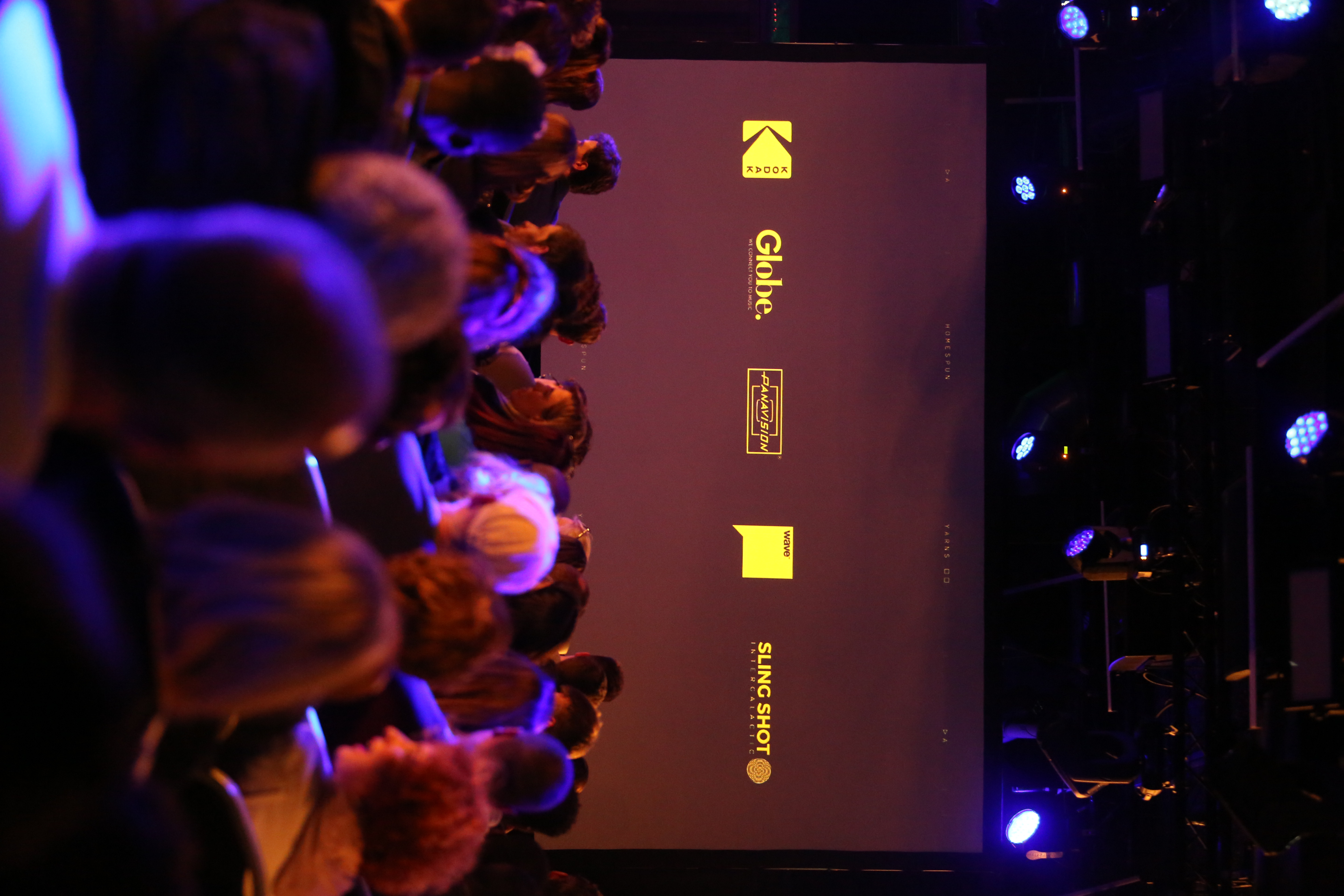Event space at The Box, Ministry of Sound, with sponsor logos and engaging audience.