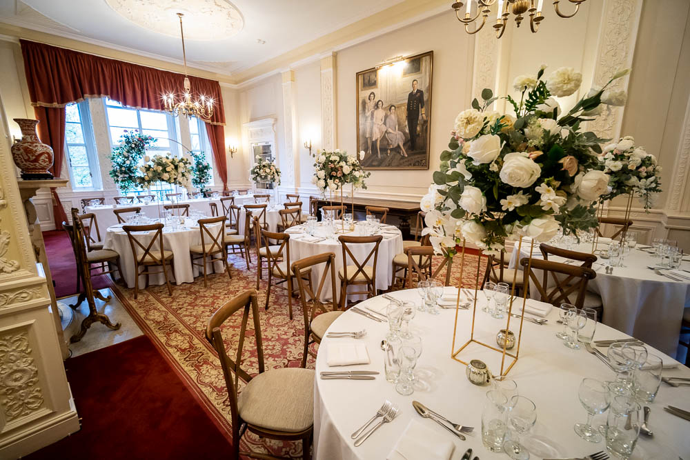 Elegant event space at Six Park Place with floral centerpieces, ideal for weddings and corporate events.