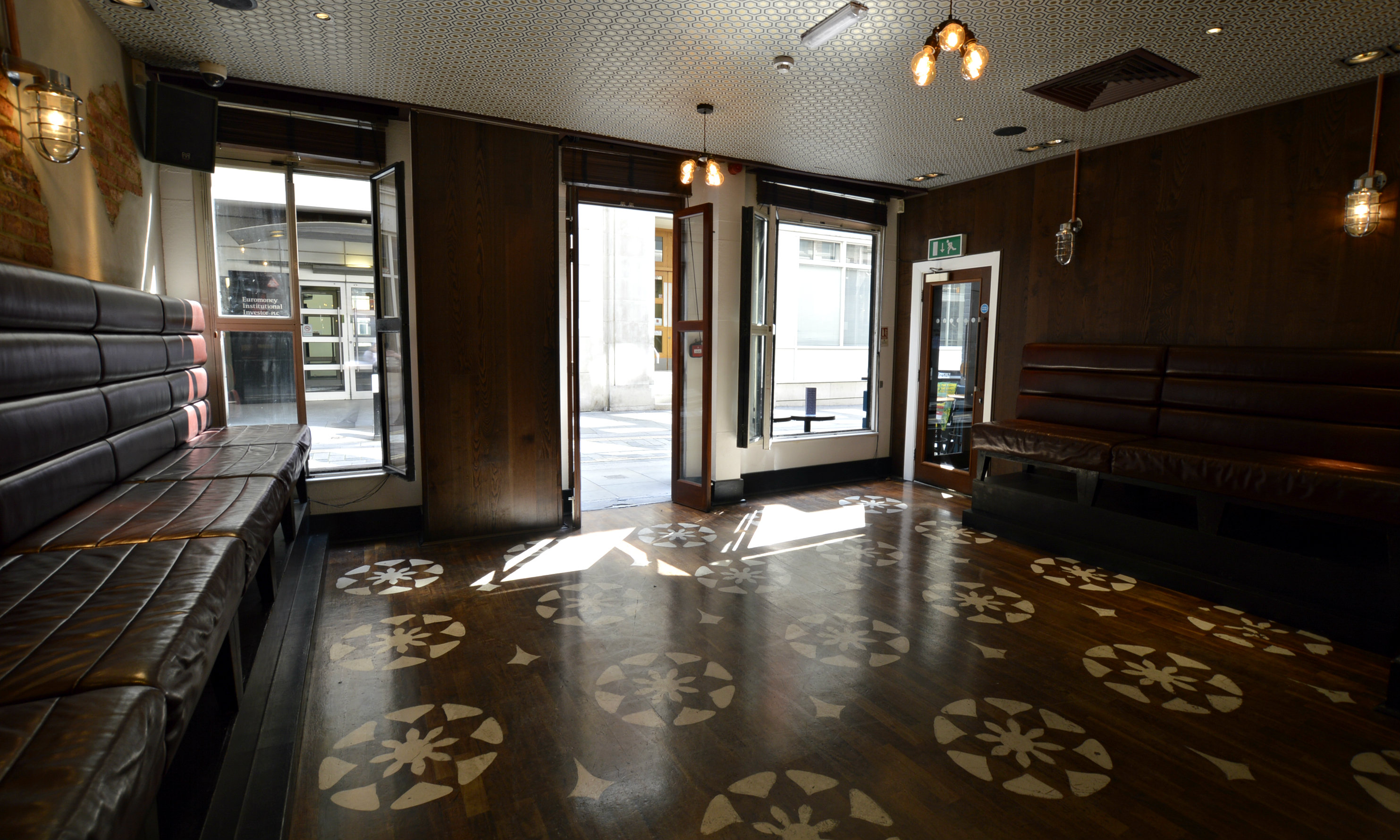 Private room at Patch St Paul’s with dark wood accents, perfect for meetings and gatherings.