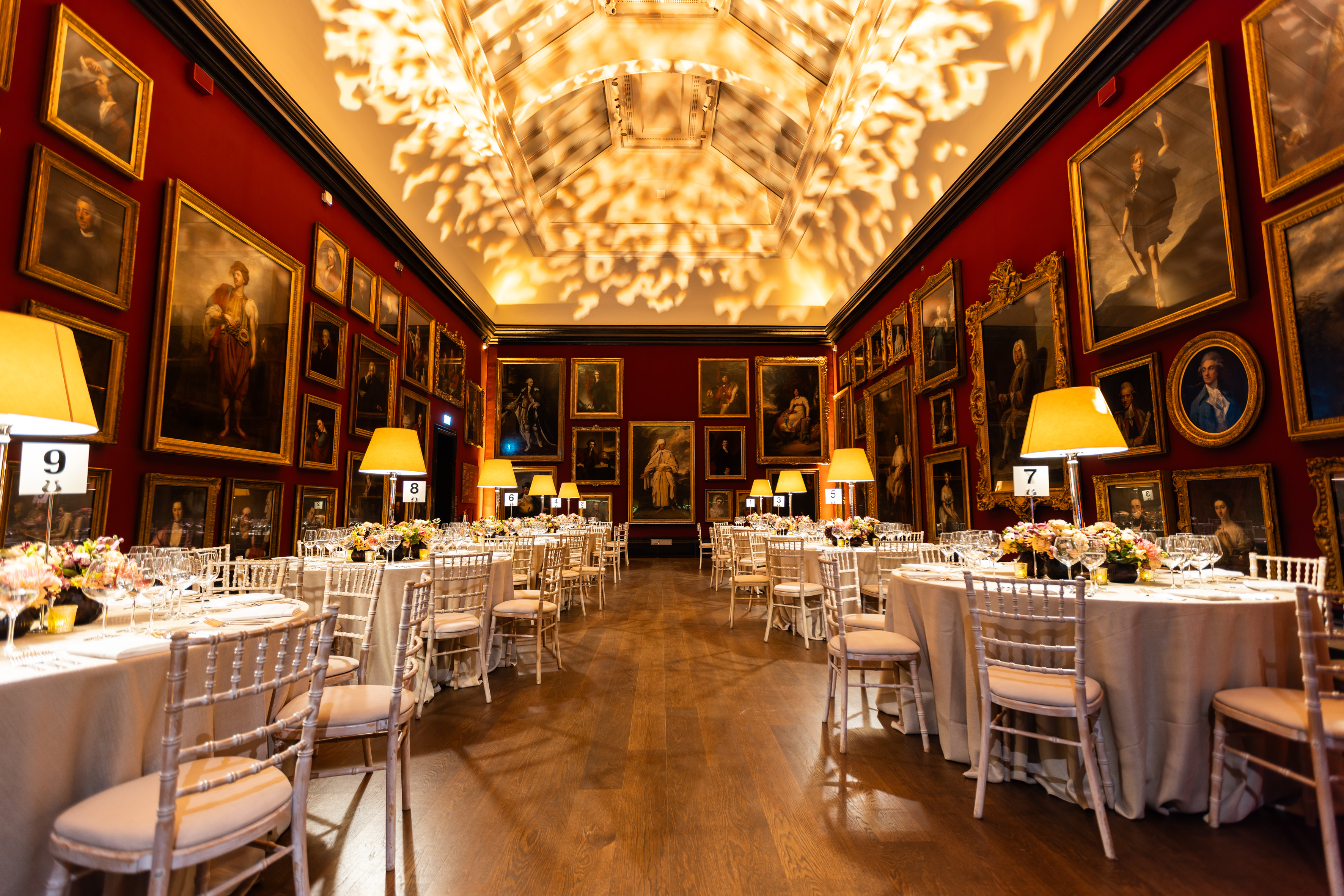 Elegant banquet hall with floral centerpieces in National Portrait Gallery for upscale events.