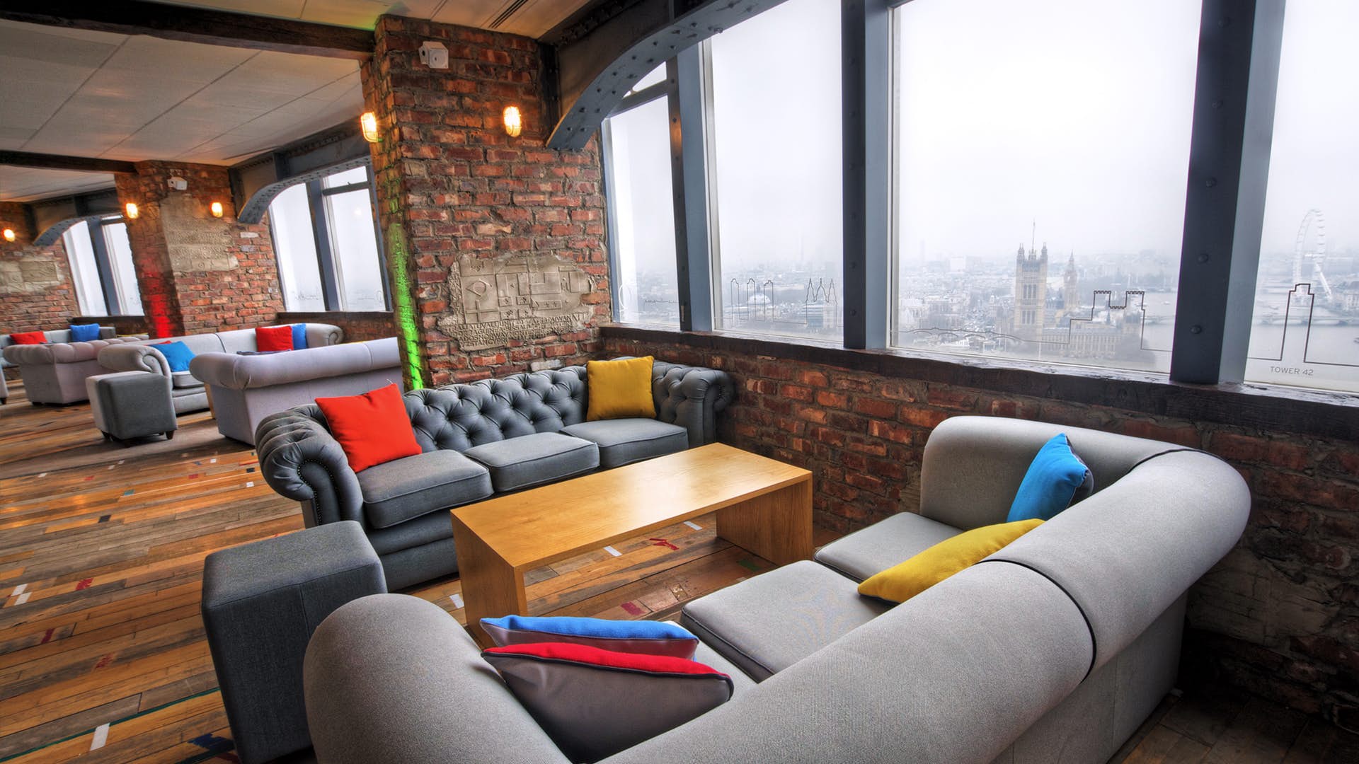 Modern lounge venue with panoramic city views, ideal for networking events.