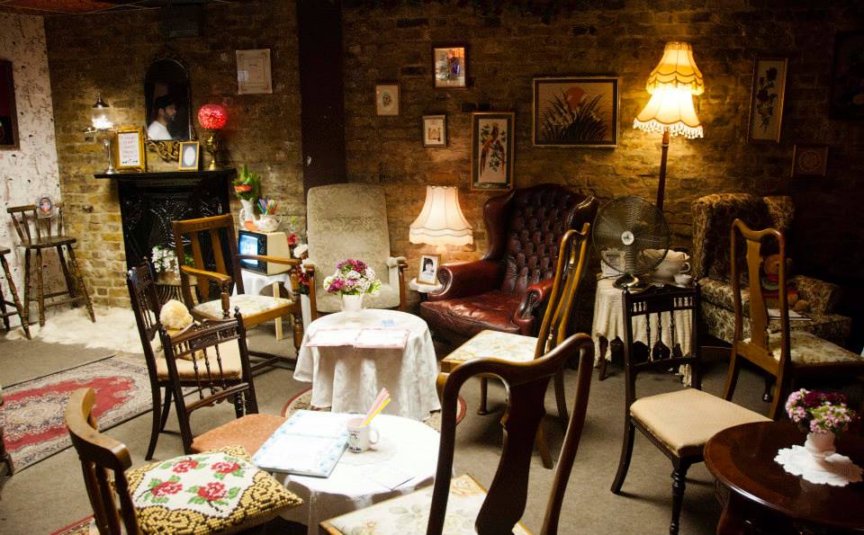 Fireside chat space at Little Nan's Bar, featuring cozy, eclectic residential decor for micro-events.