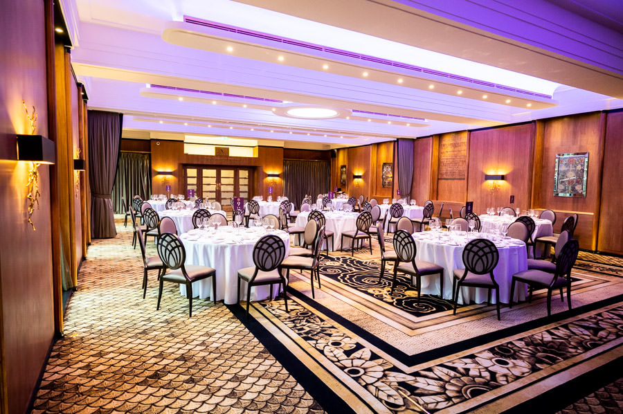 Hall of India event space with round tables, ideal for corporate meetings and banquets.