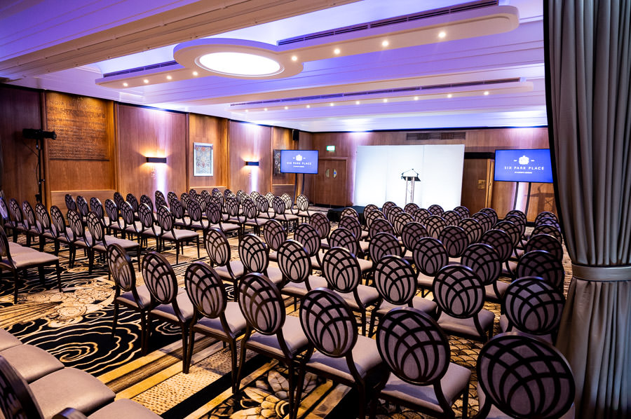 Hall of India event space with elegant chairs, perfect for corporate presentations.