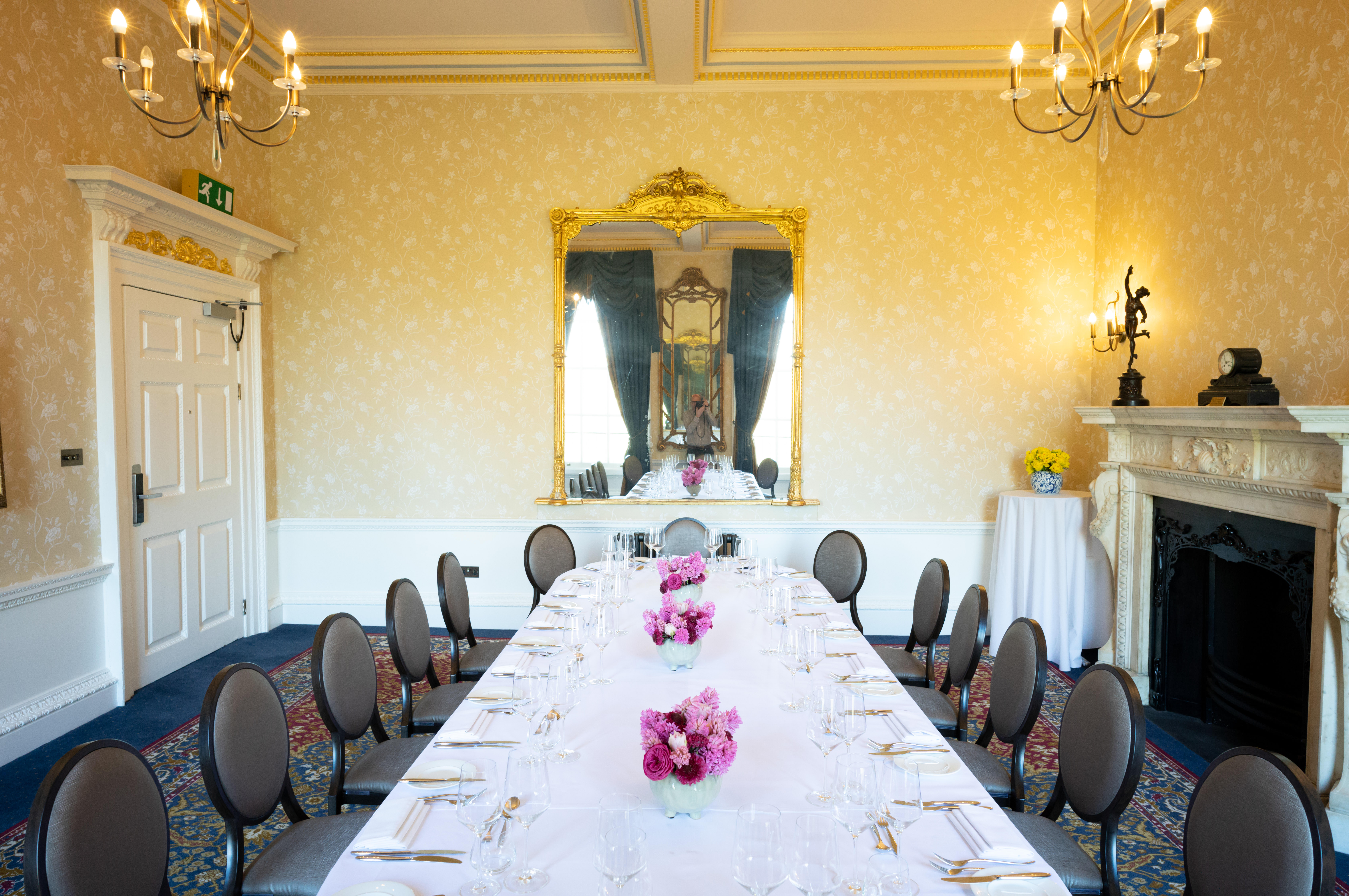 Elegant Rutland Room with floral centerpieces for corporate events and gatherings.