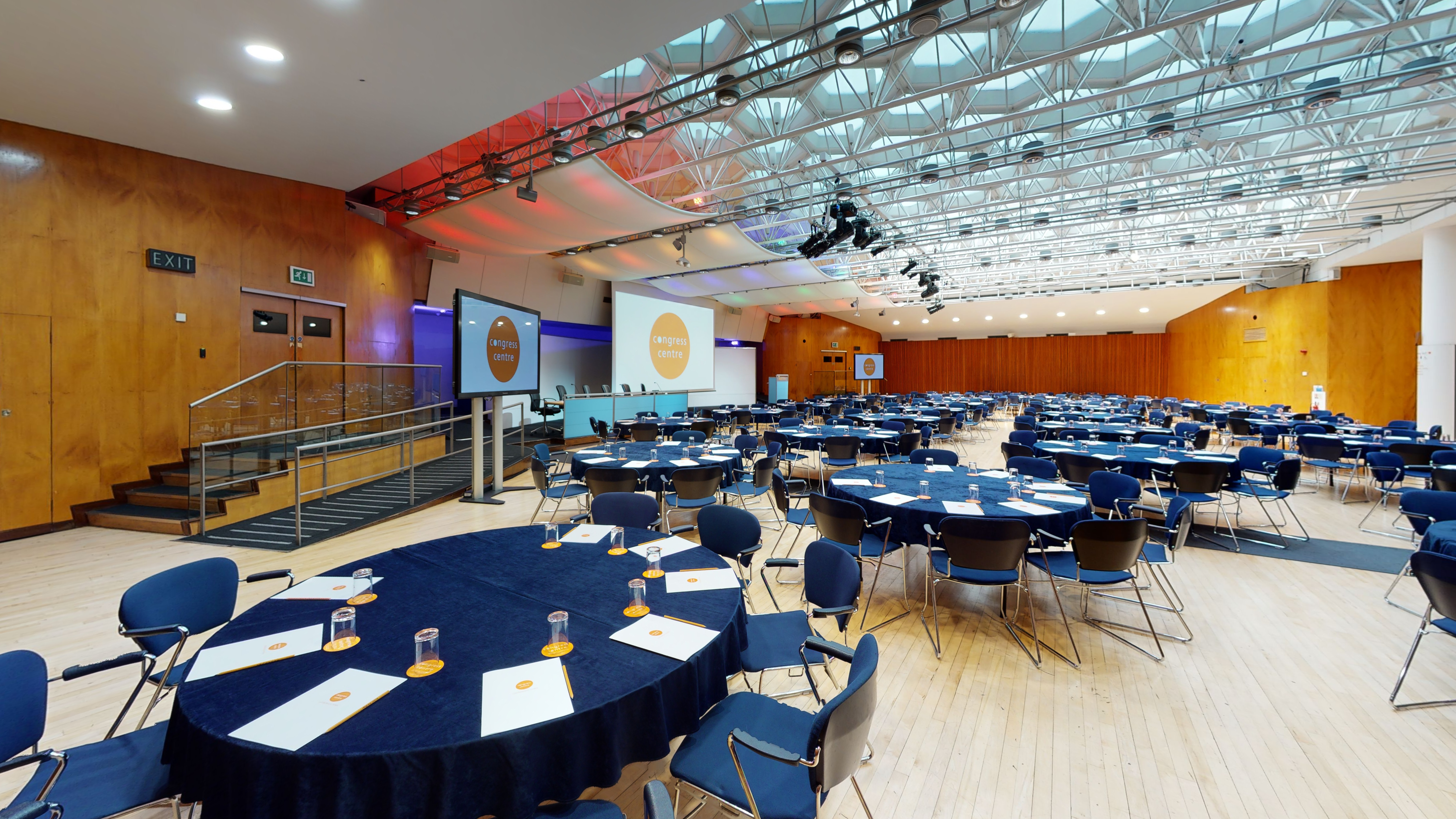 Congress Hall event space with round tables, ideal for conferences and banquets.