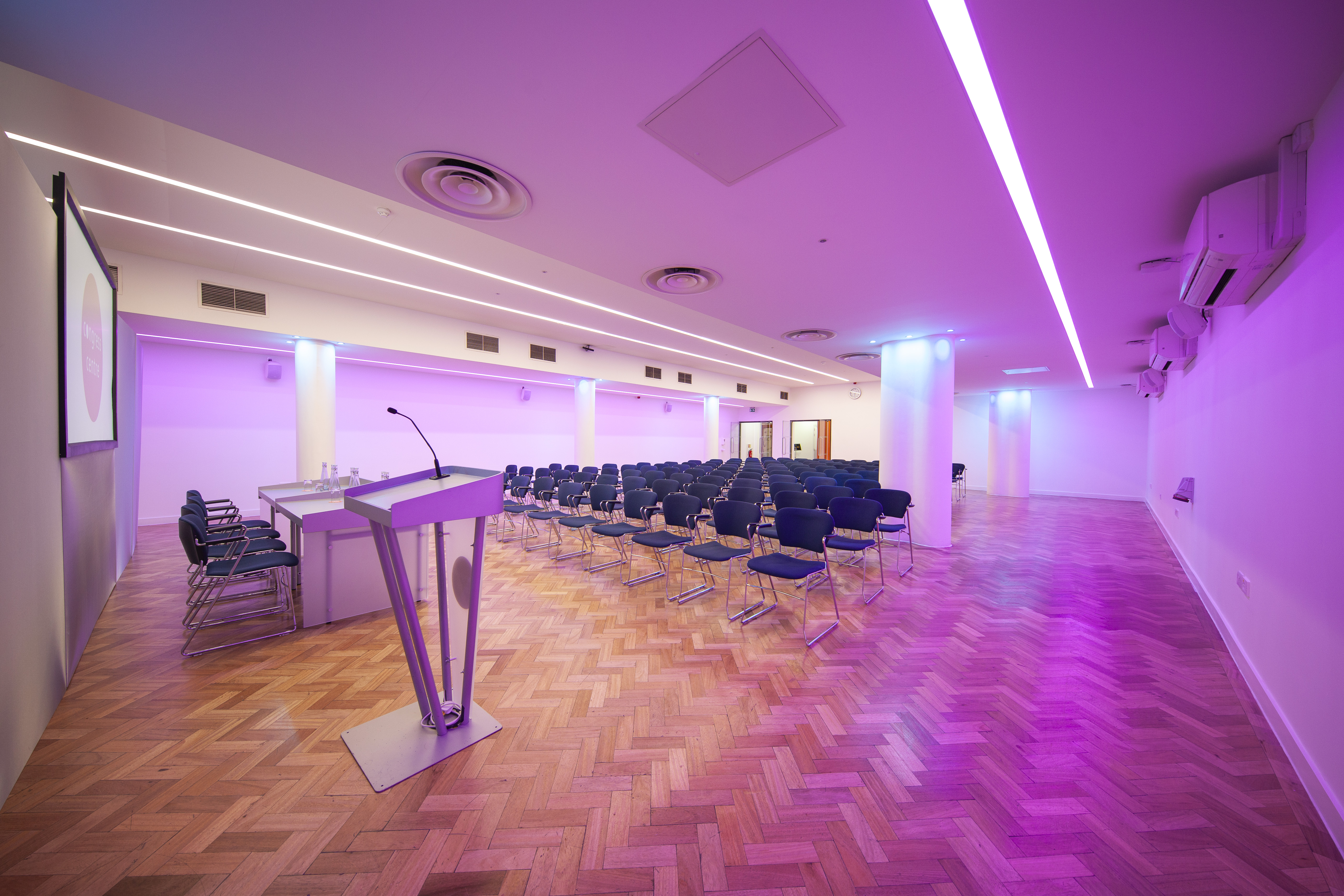 Modern Congress Suite with sleek podium, ideal for conferences and corporate events.