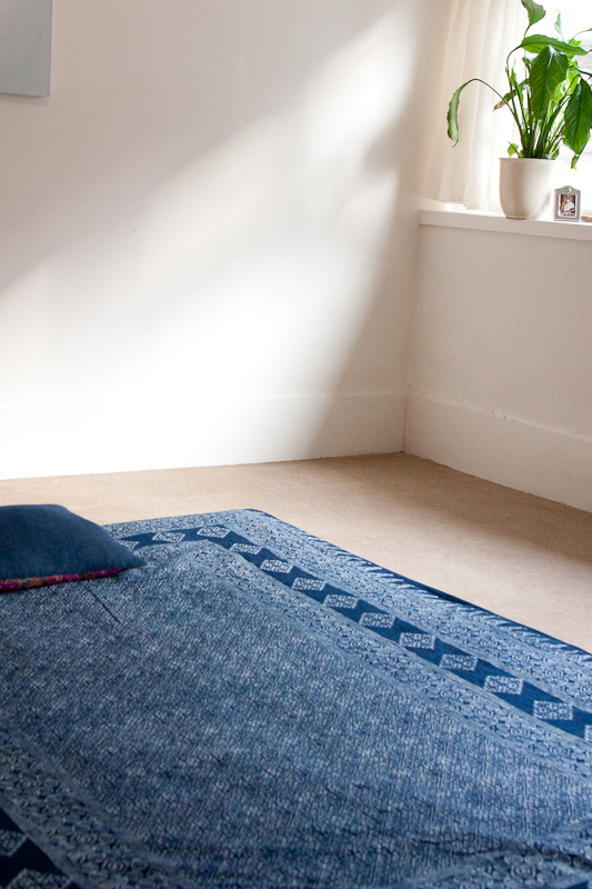 Serene therapy room with floor seating for mindfulness sessions and intimate gatherings.