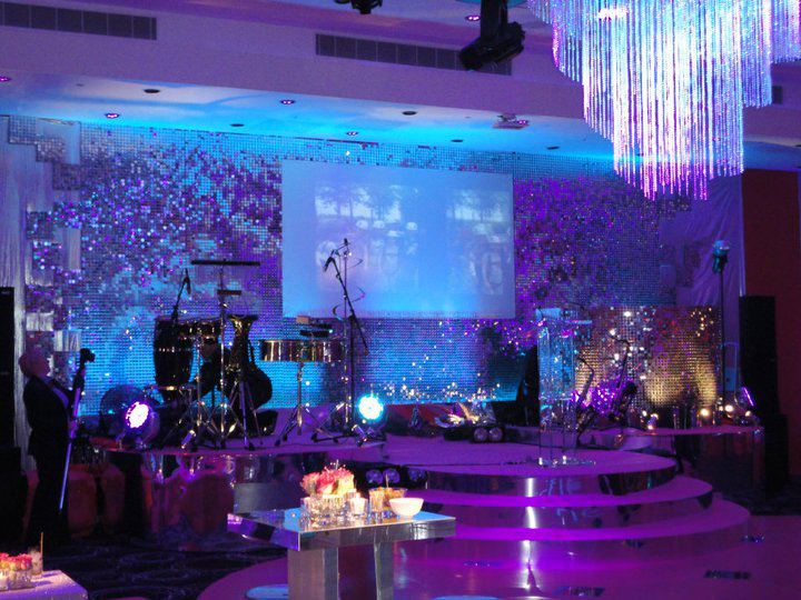 Vibrant London Stock Exchange event space with stage setup for live entertainment.