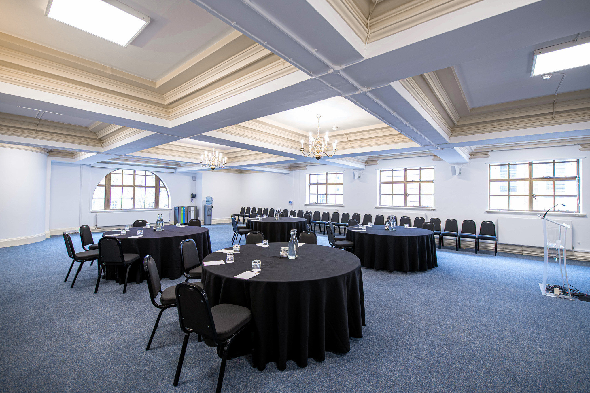 William Sangster in Central Hall Westminster, versatile meeting space with round tables.