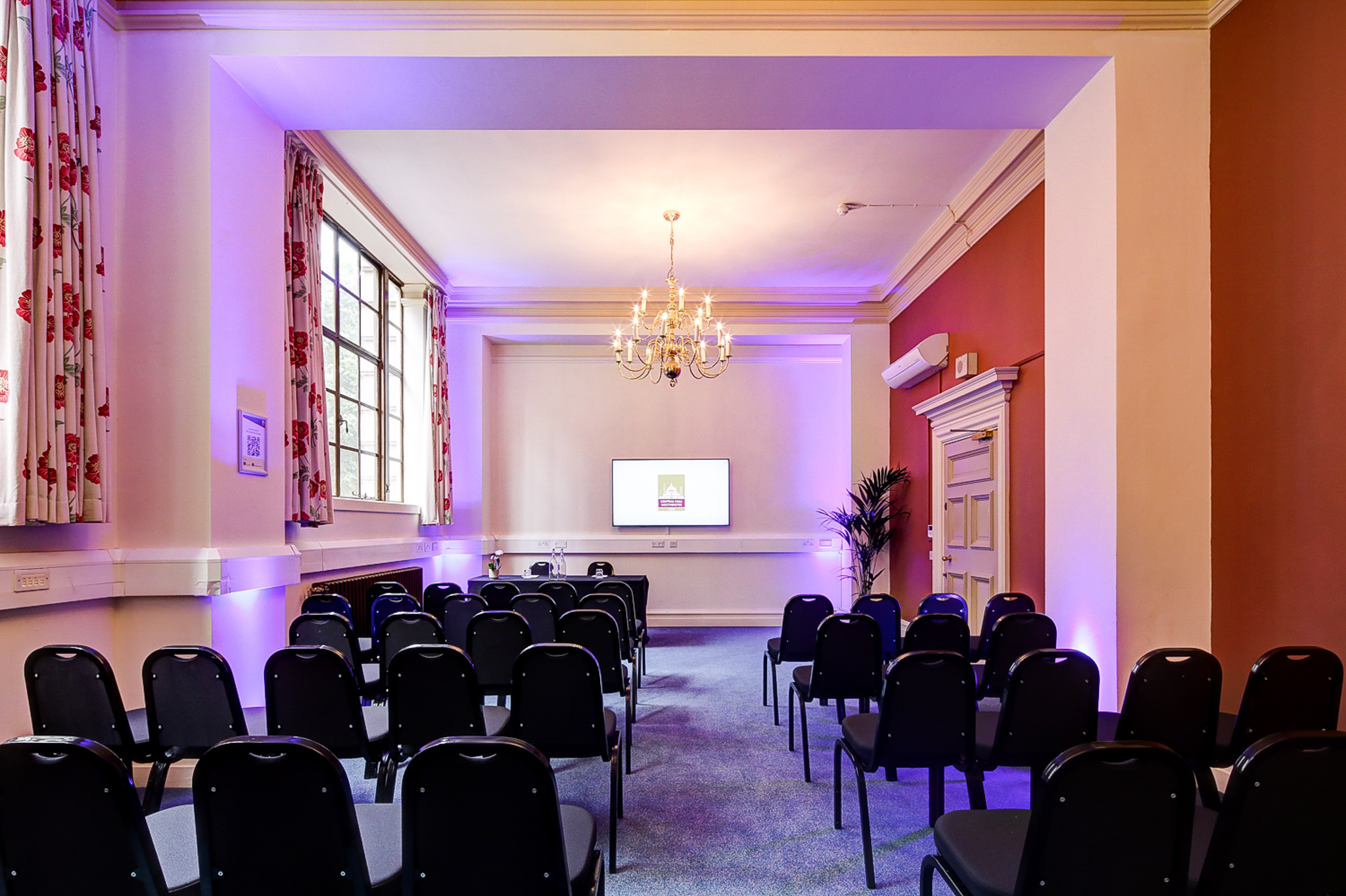 Maurice Barnett in a well-lit Central Hall Westminster meeting room for presentations.