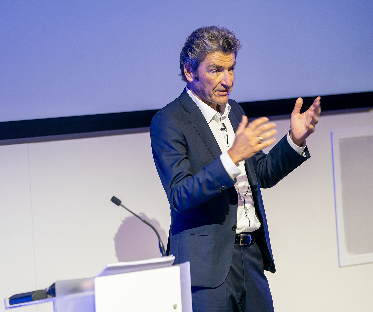 Speaker engaging audience in Auditorium at 30 Euston Square during a presentation event.