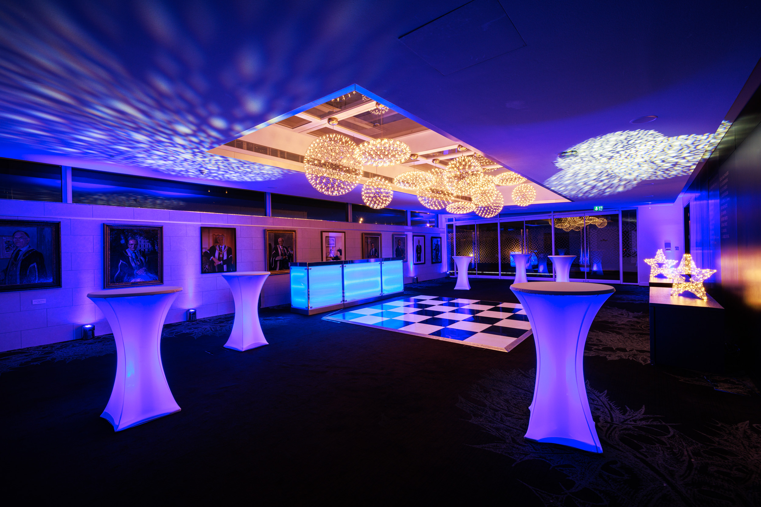 Elegant event space at 30 Euston Square with modern decor and checkered dance floor.