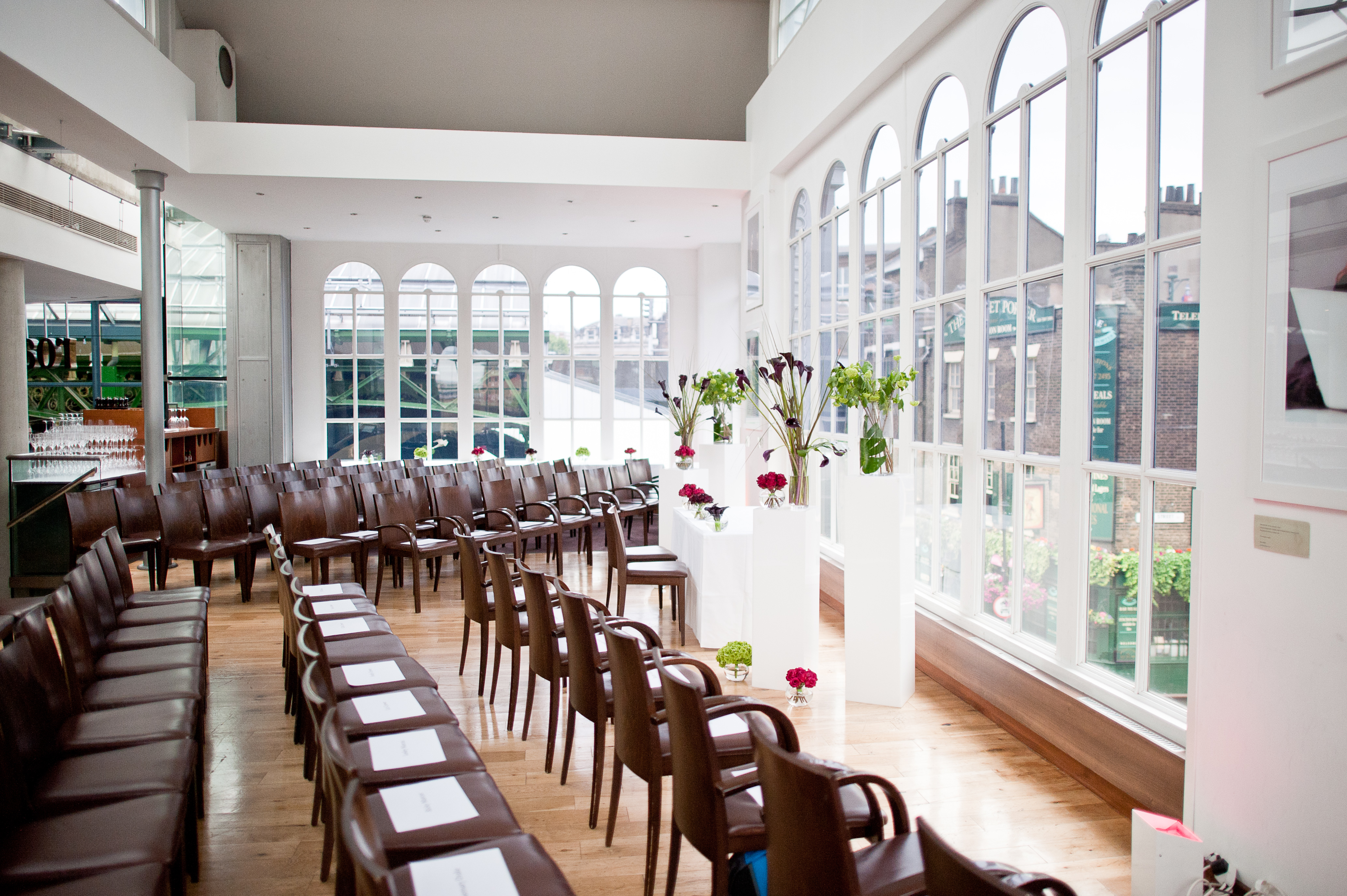 Elegant event space with semi-circle seating, ideal for corporate meetings and gatherings.