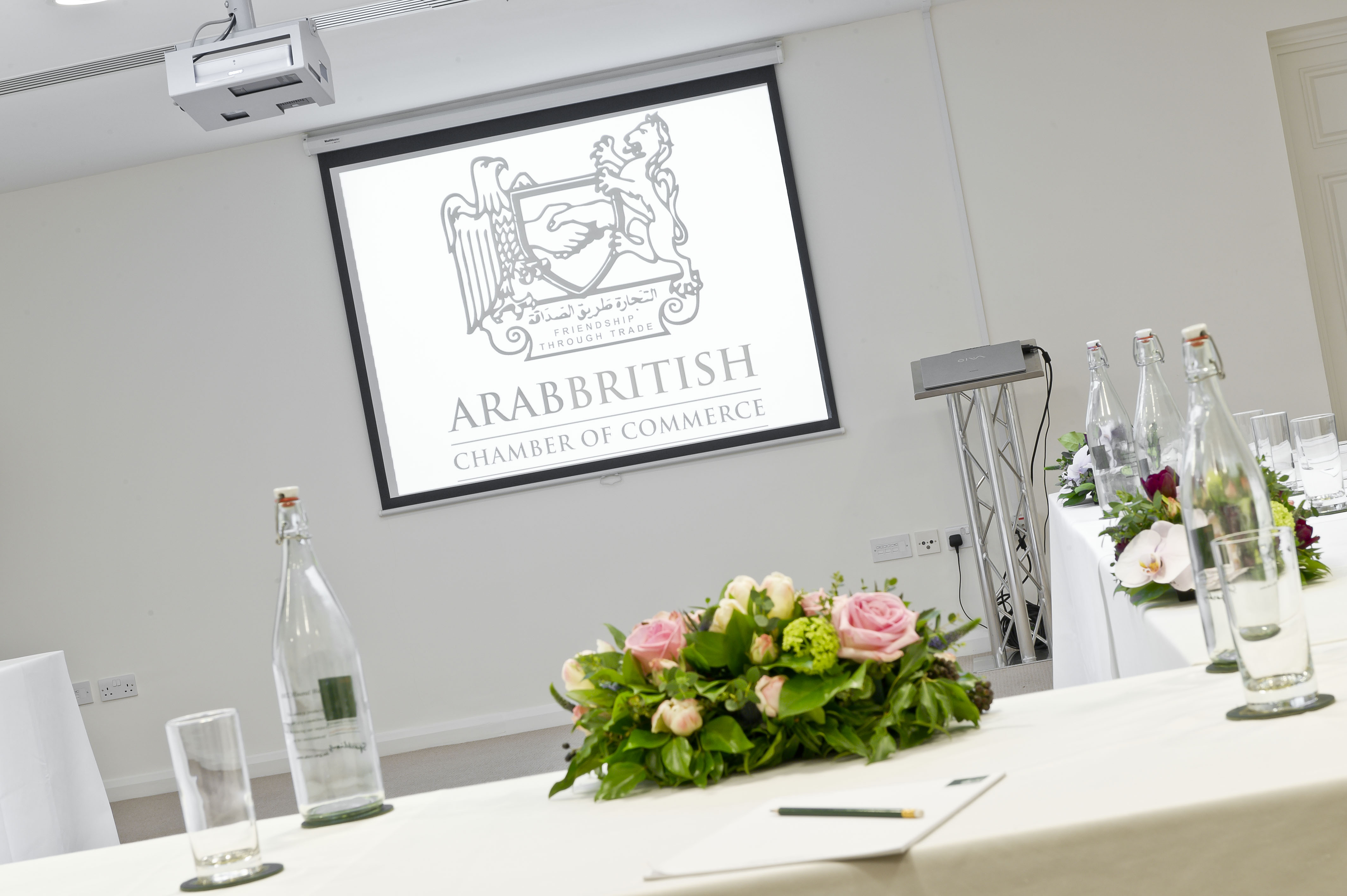 Ivory Suite meeting space with projector, ideal for conferences and presentations.