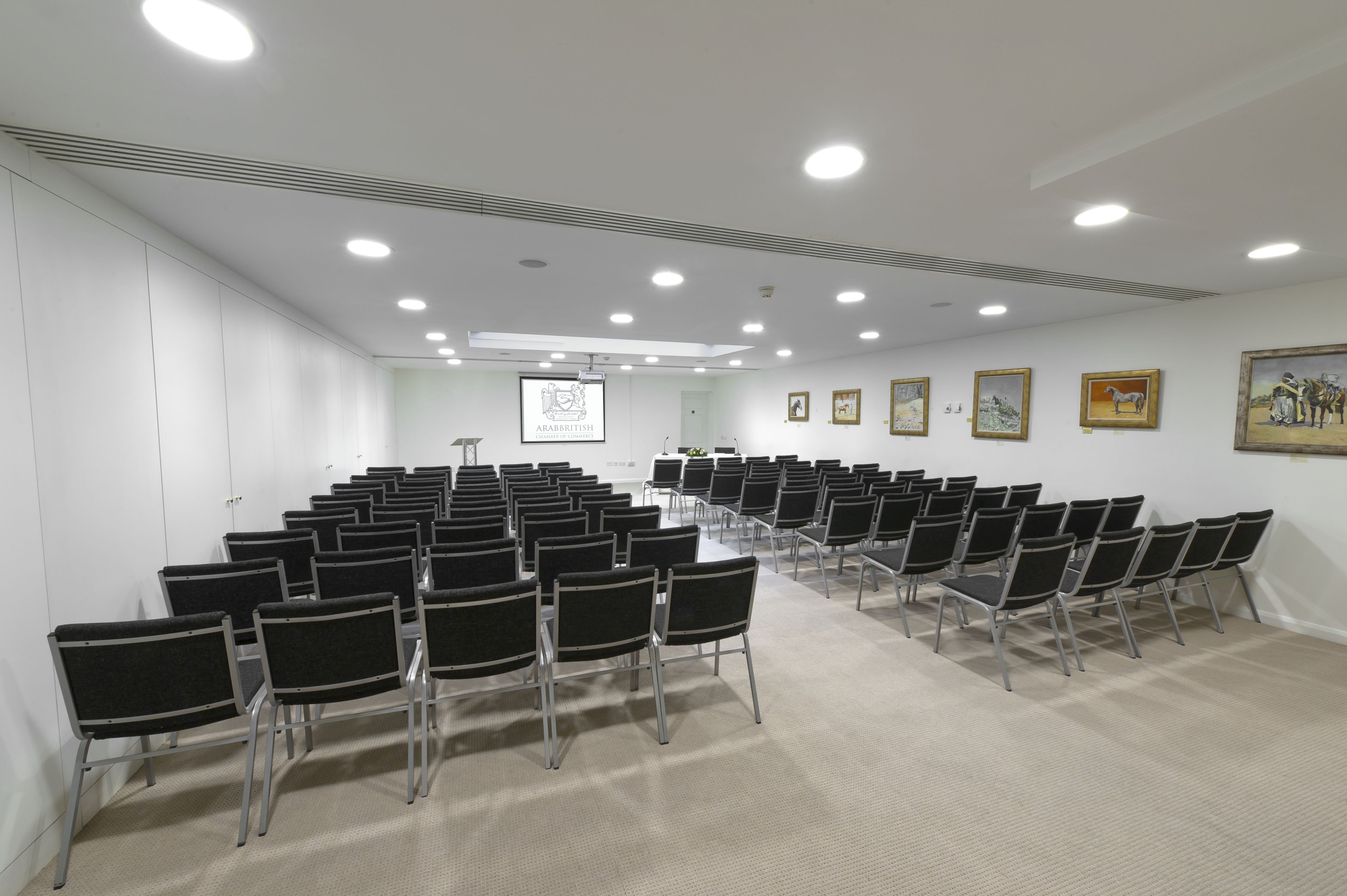 Ivory Suite meeting space with black chairs for corporate events and workshops.