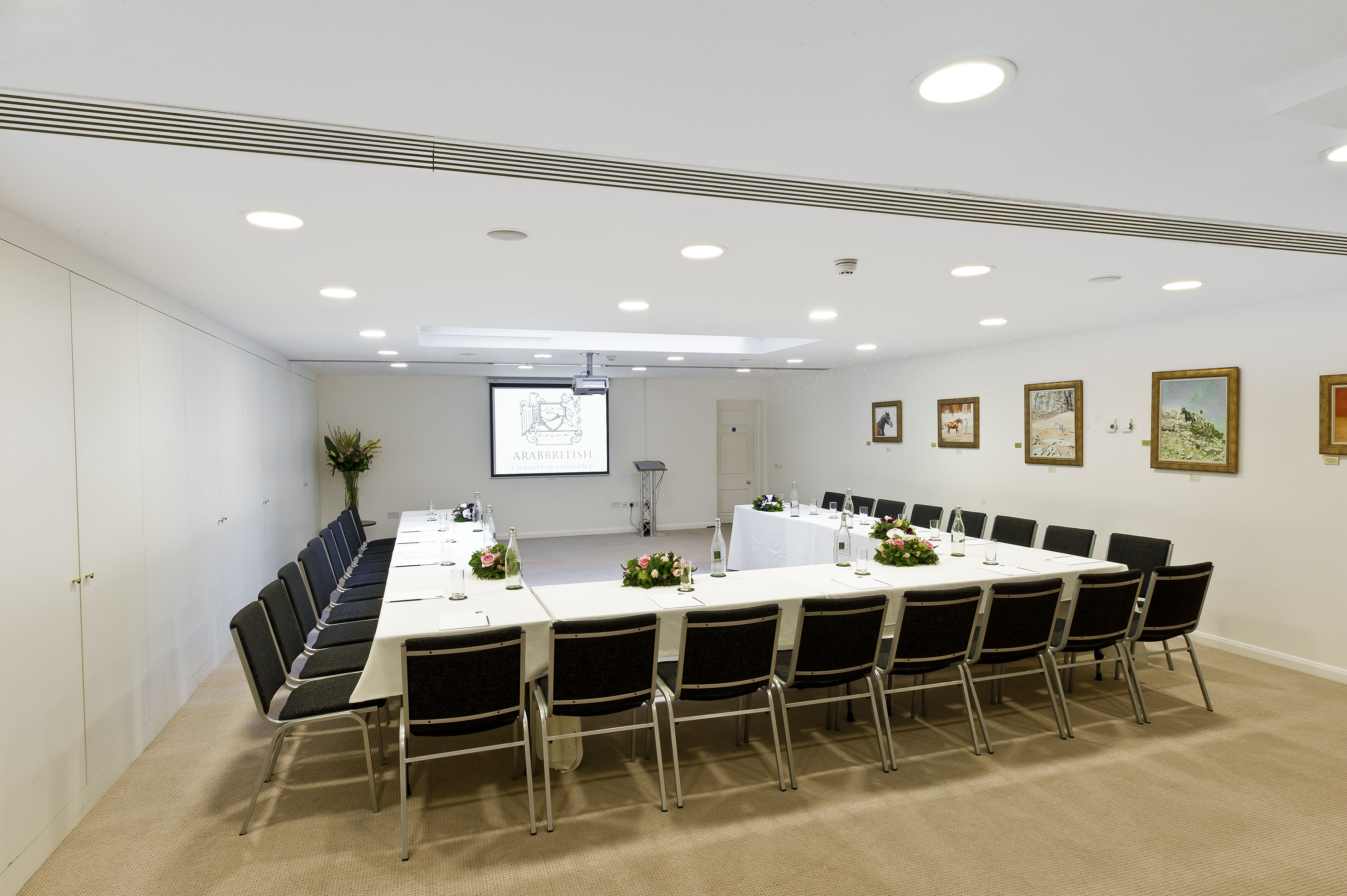Ivory Suite meeting room with projector, ideal for professional events and workshops.