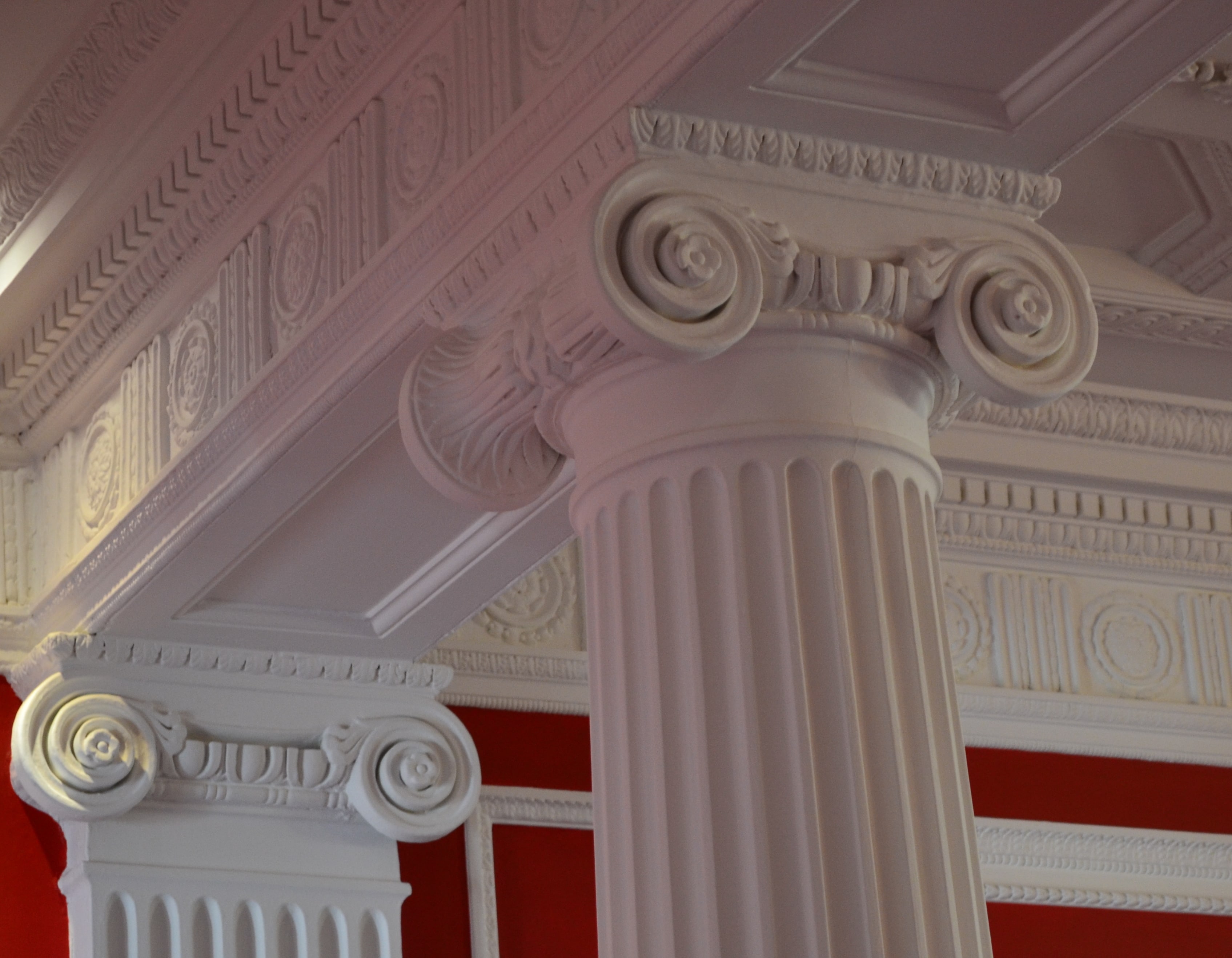 Elegant Rose Suite with classic columns, perfect for upscale events and meetings.