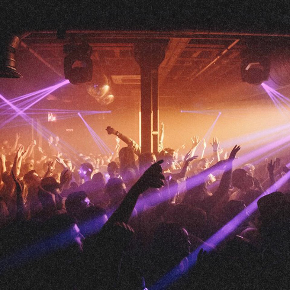 Vibrant nightlife at XOYO MAIN SPACE with dynamic laser beams for engaging events.