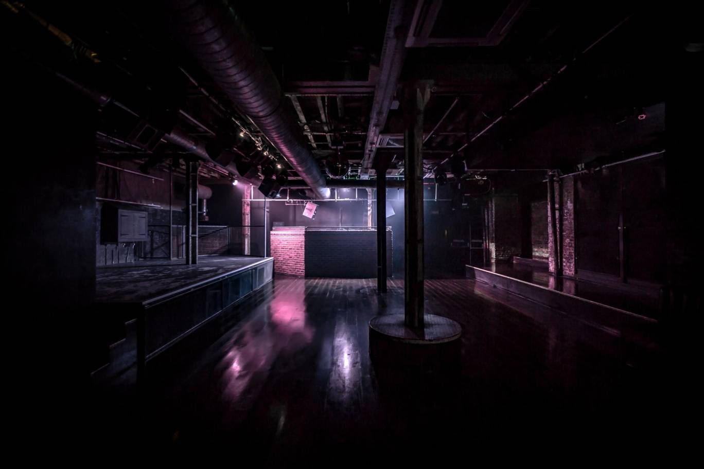 Versatile XOYO Main Space with industrial vibe, ideal for events and gatherings.