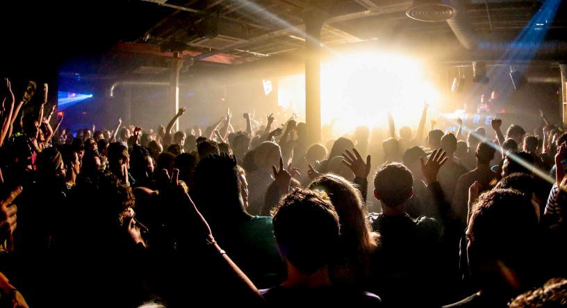 Vibrant crowd at XOYO venue hire, showcasing energetic concert atmosphere and engagement.