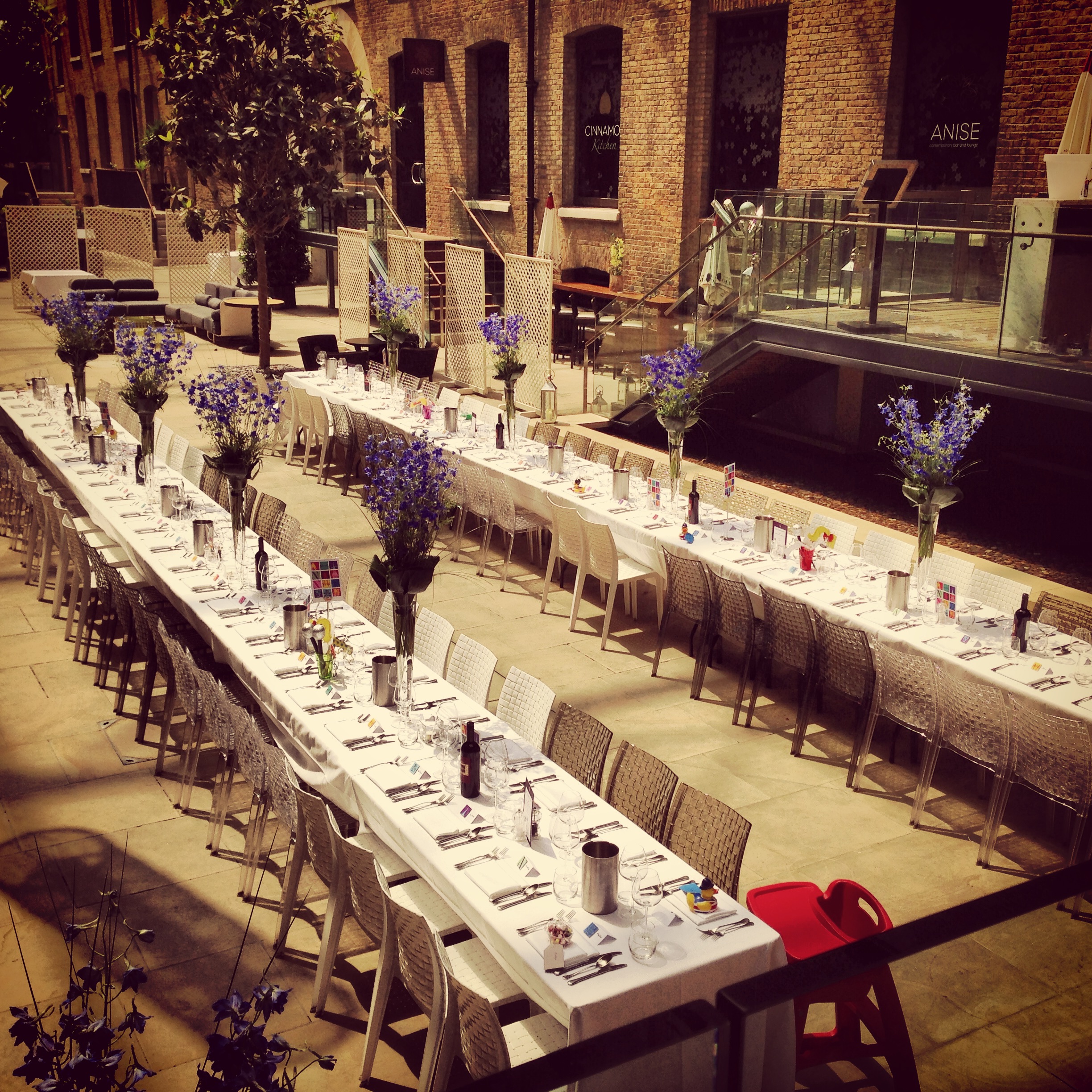 Elegant long table setup with floral centerpieces at Devonshire Terrace event venue.