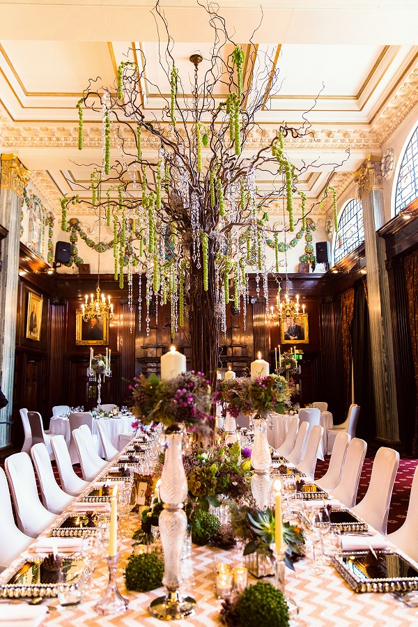 Elegant event space with crystal tree centerpiece, perfect for weddings and upscale gatherings.