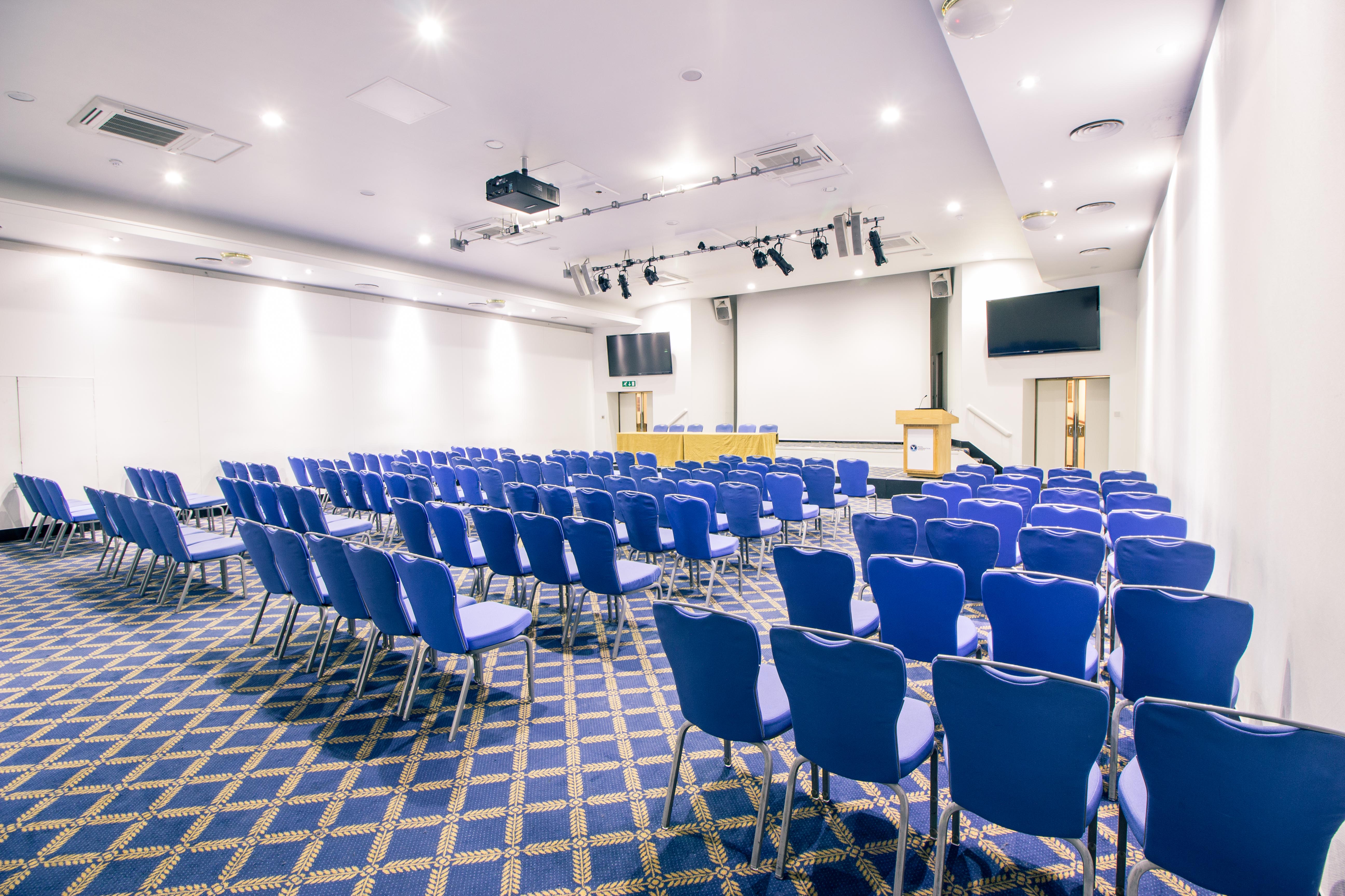 Bill Boeing Room with blue chairs, ideal for conferences and presentations.