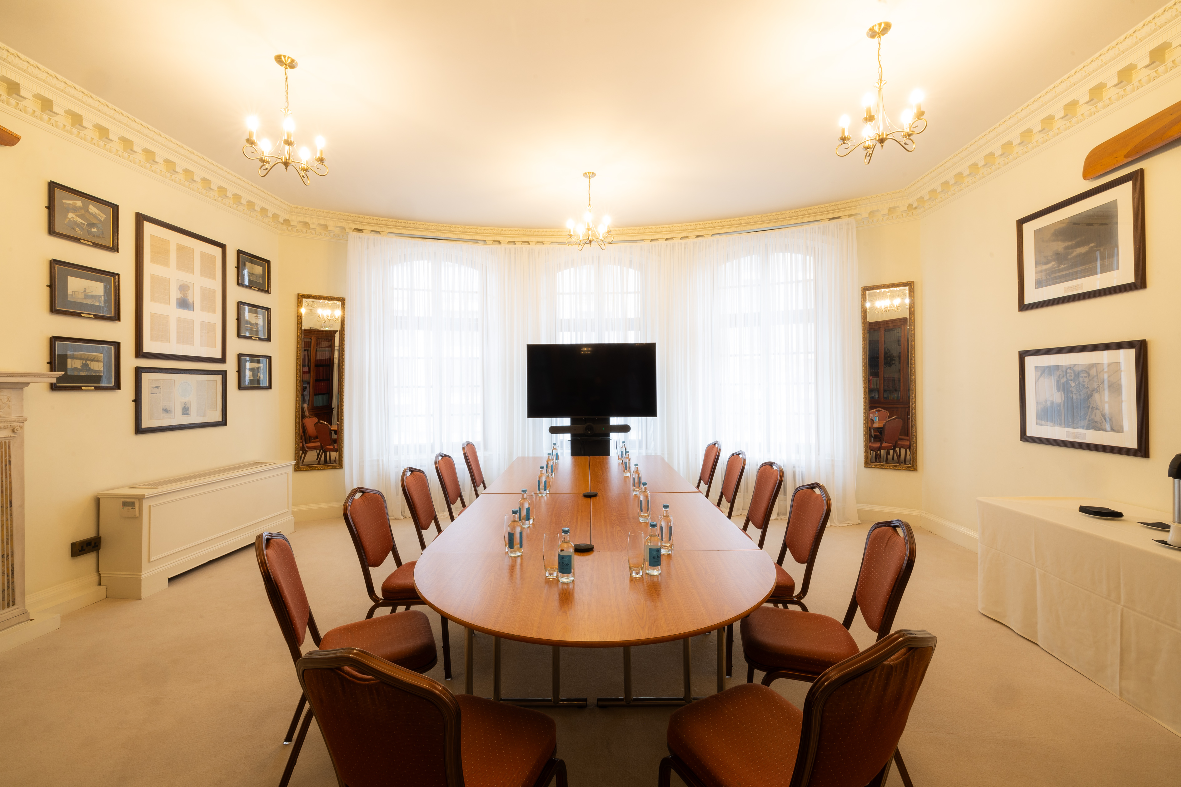 Sopwith Room meeting space with oval table, ideal for professional gatherings and presentations.