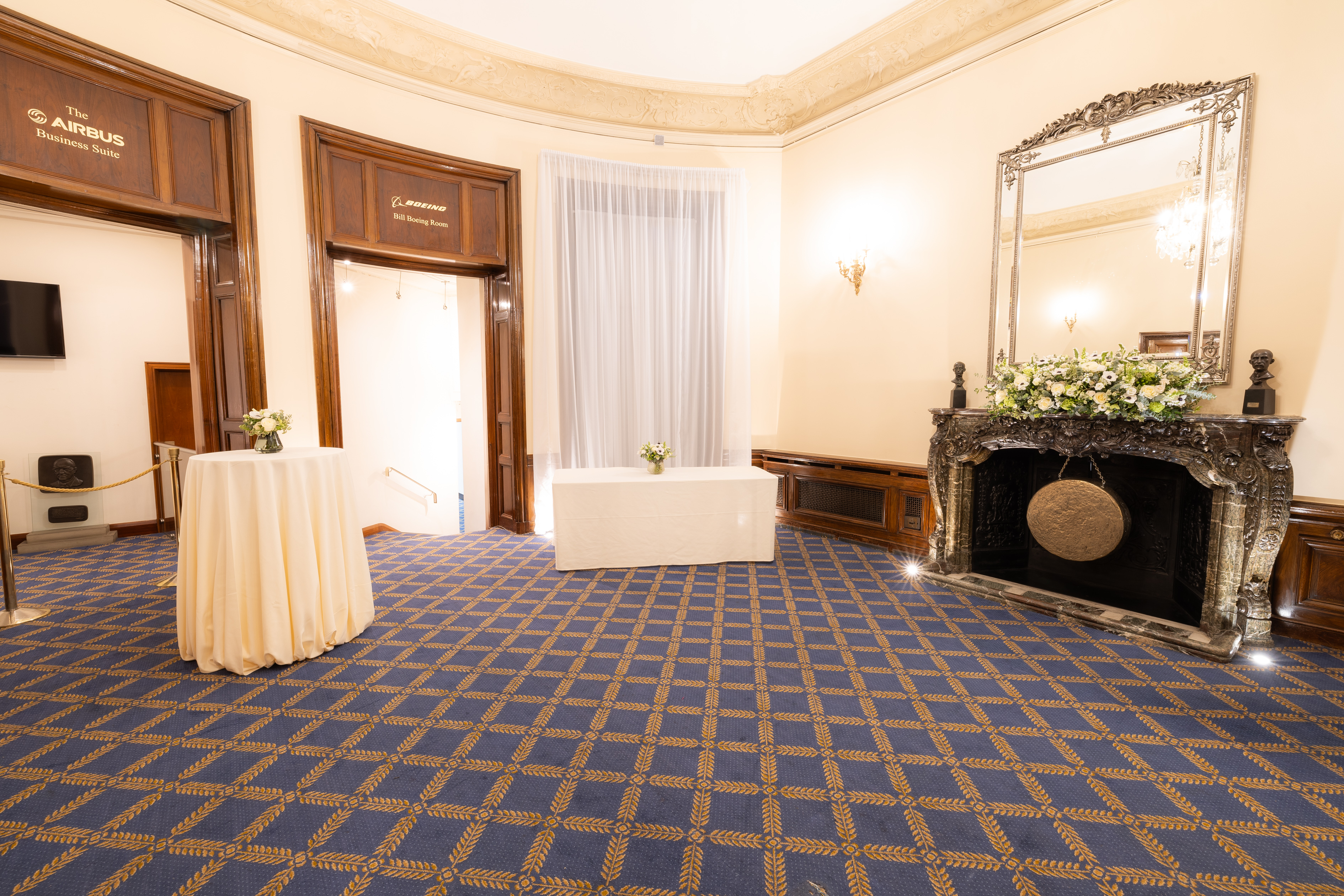 Elegant event space at Marshall of Cambridge, featuring round tables and natural light.