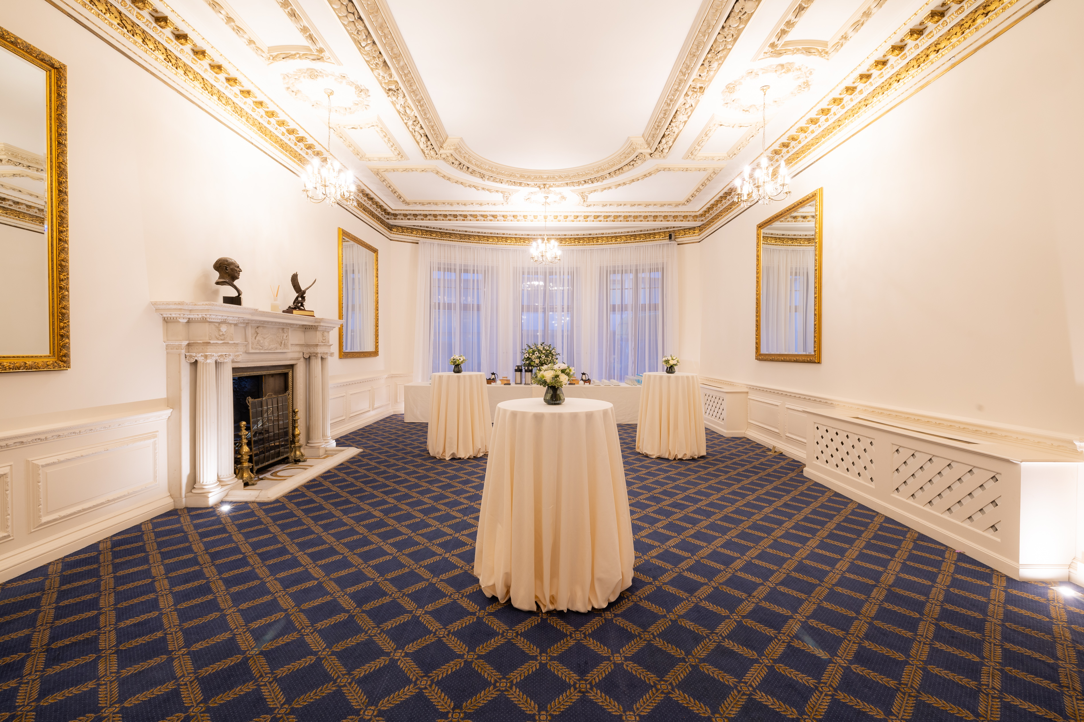 Elegant event space with chandeliers, perfect for cocktail receptions and networking.