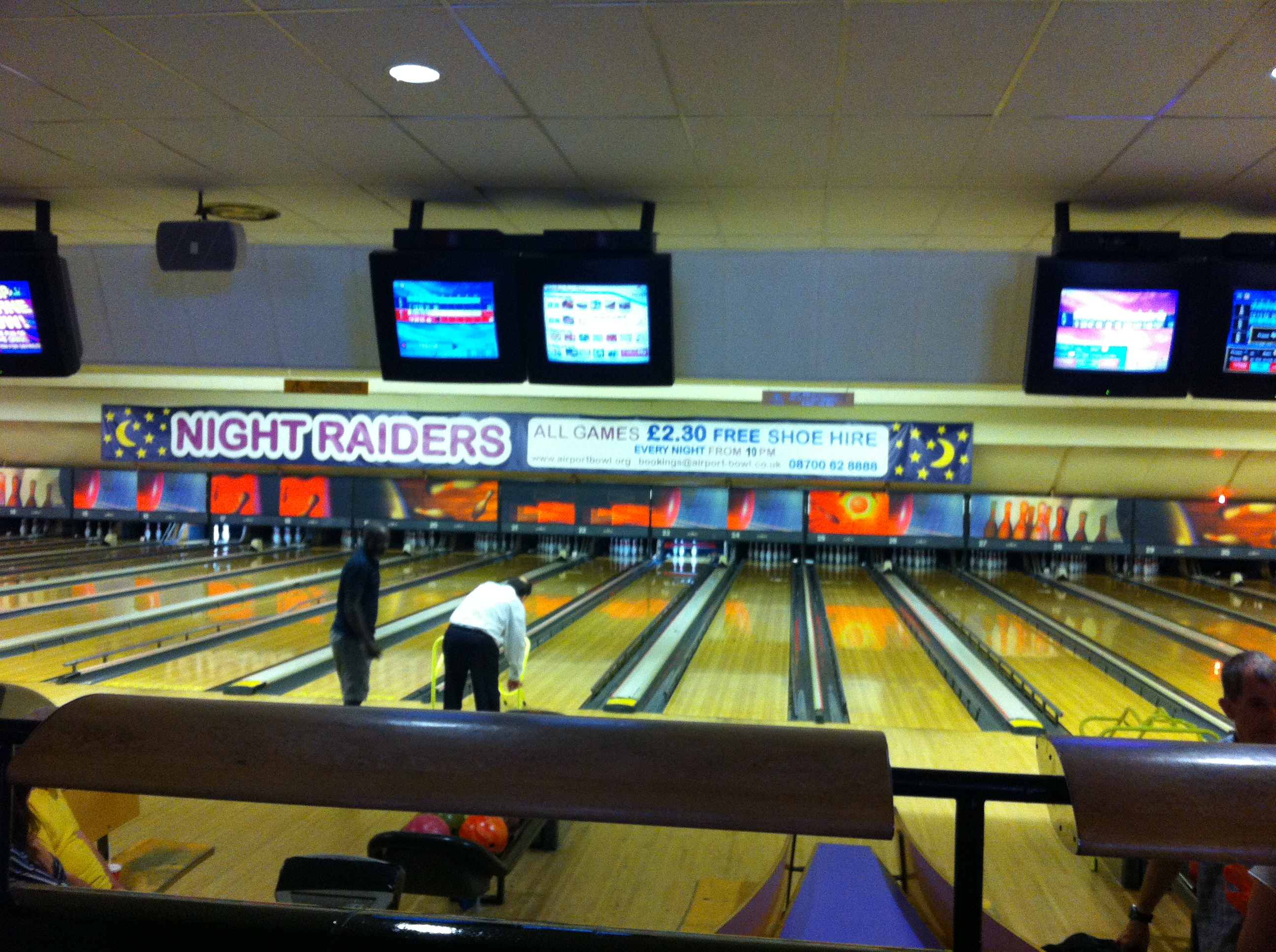 Vibrant bowling lanes at Airport Bowl for corporate events and team-building activities.