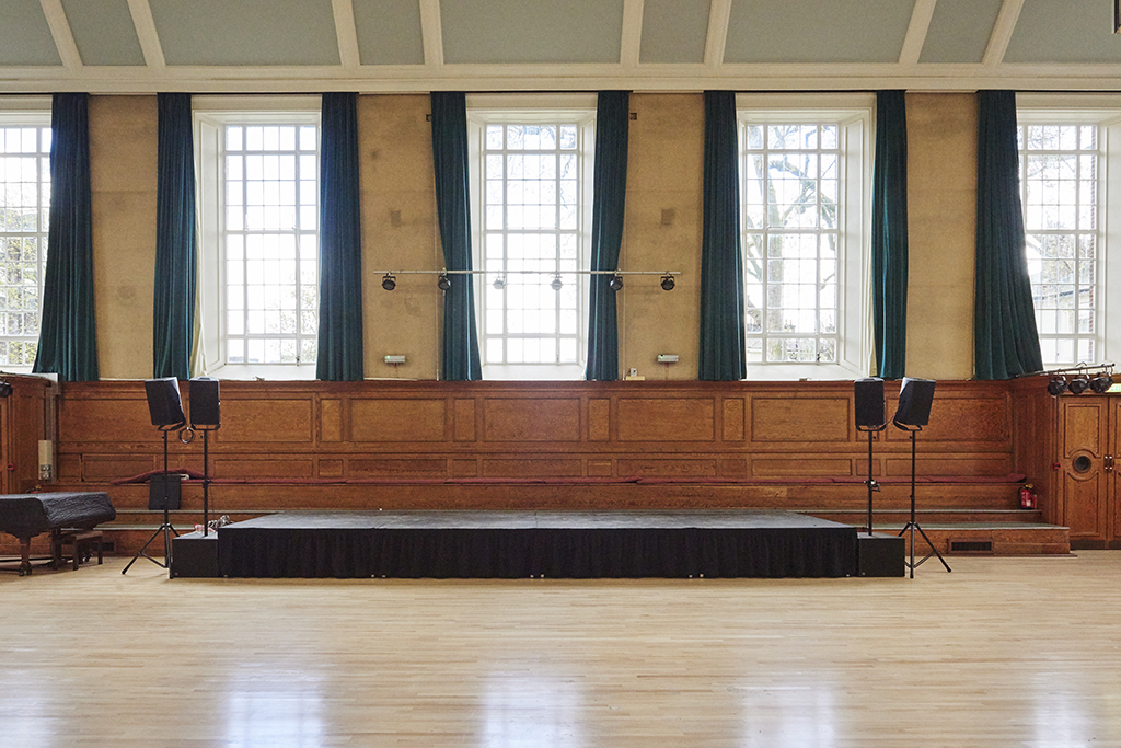 Kennedy Hall at Cecil Sharp House: versatile event space with wooden stage and natural light.