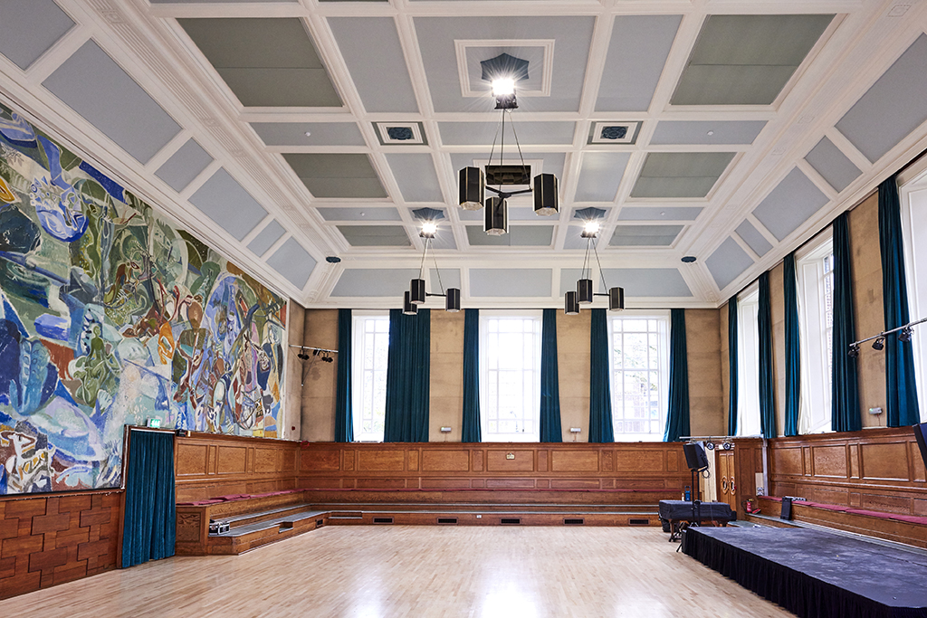 Spacious Kennedy Hall with high ceilings, ideal for conferences and workshops.