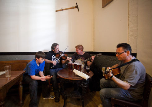 Cozy bar at Cecil Sharp House, ideal for networking and entertainment events.