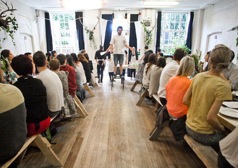 Trefusis Room at Cecil Sharp House with stilt performer for lively networking event.