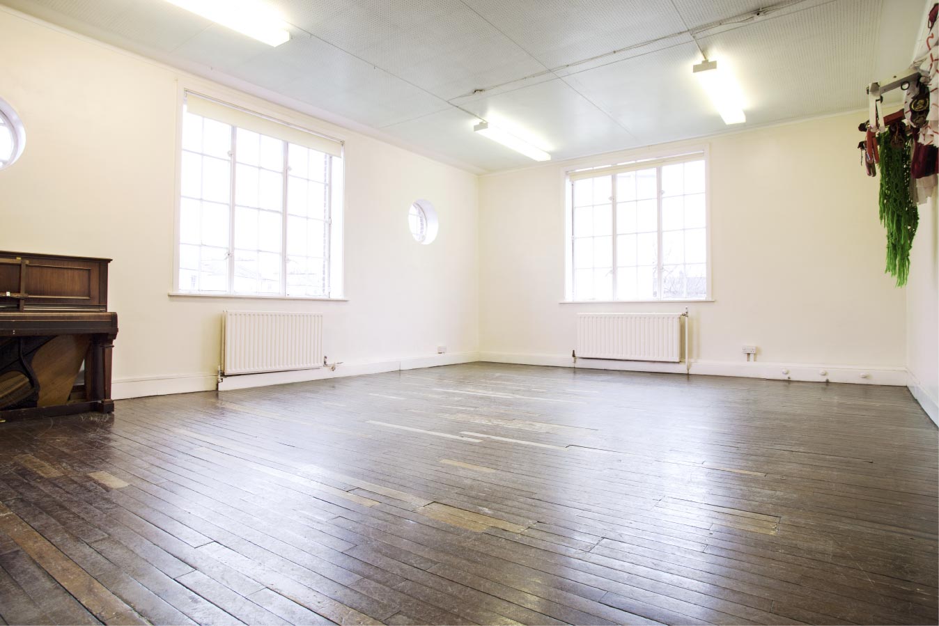 Committee Room at Cecil Sharp House, bright wooden space for workshops and gatherings.