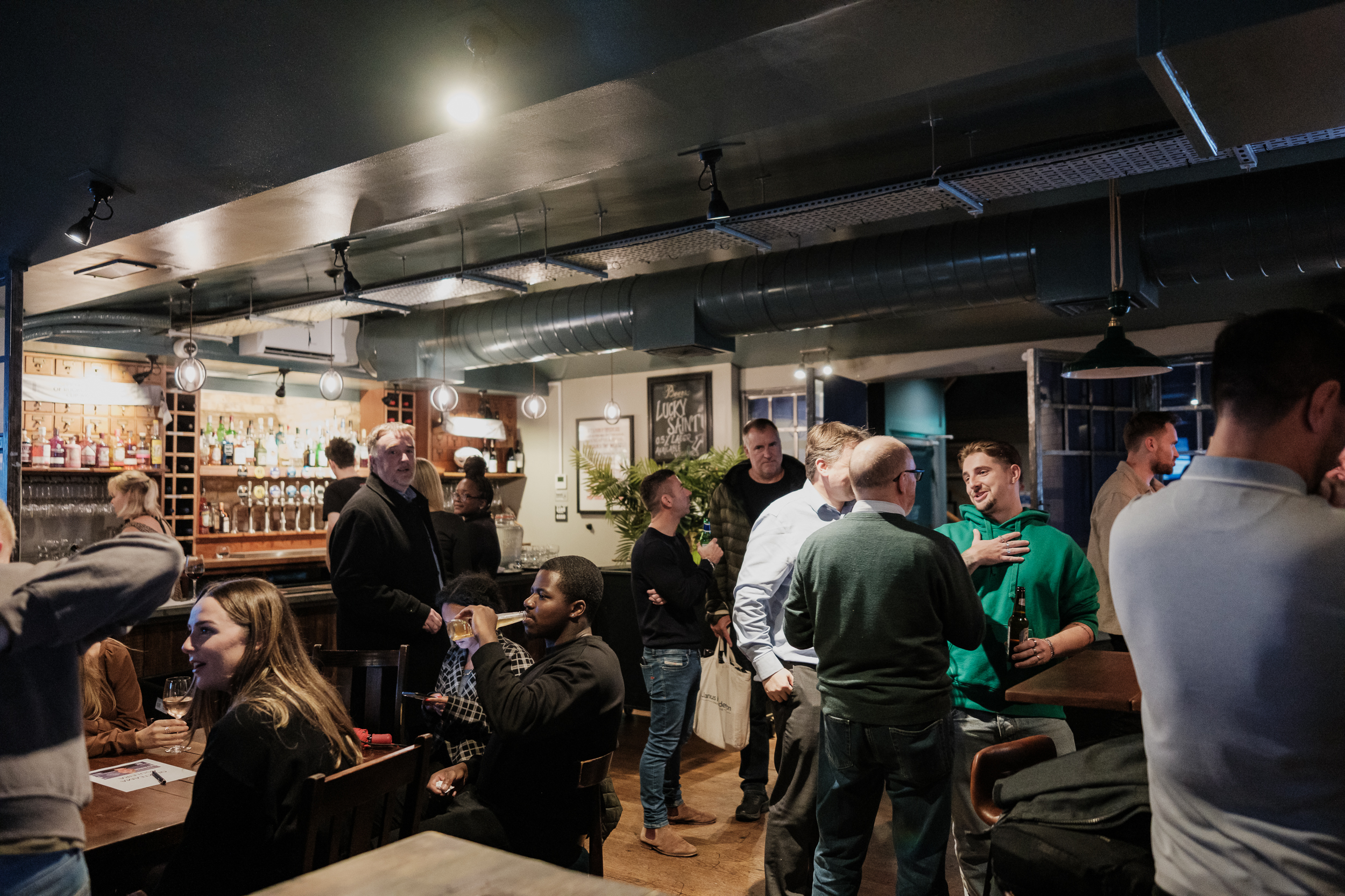 Vibrant networking event at Cellar Bar, cozy venue with engaging atmosphere.