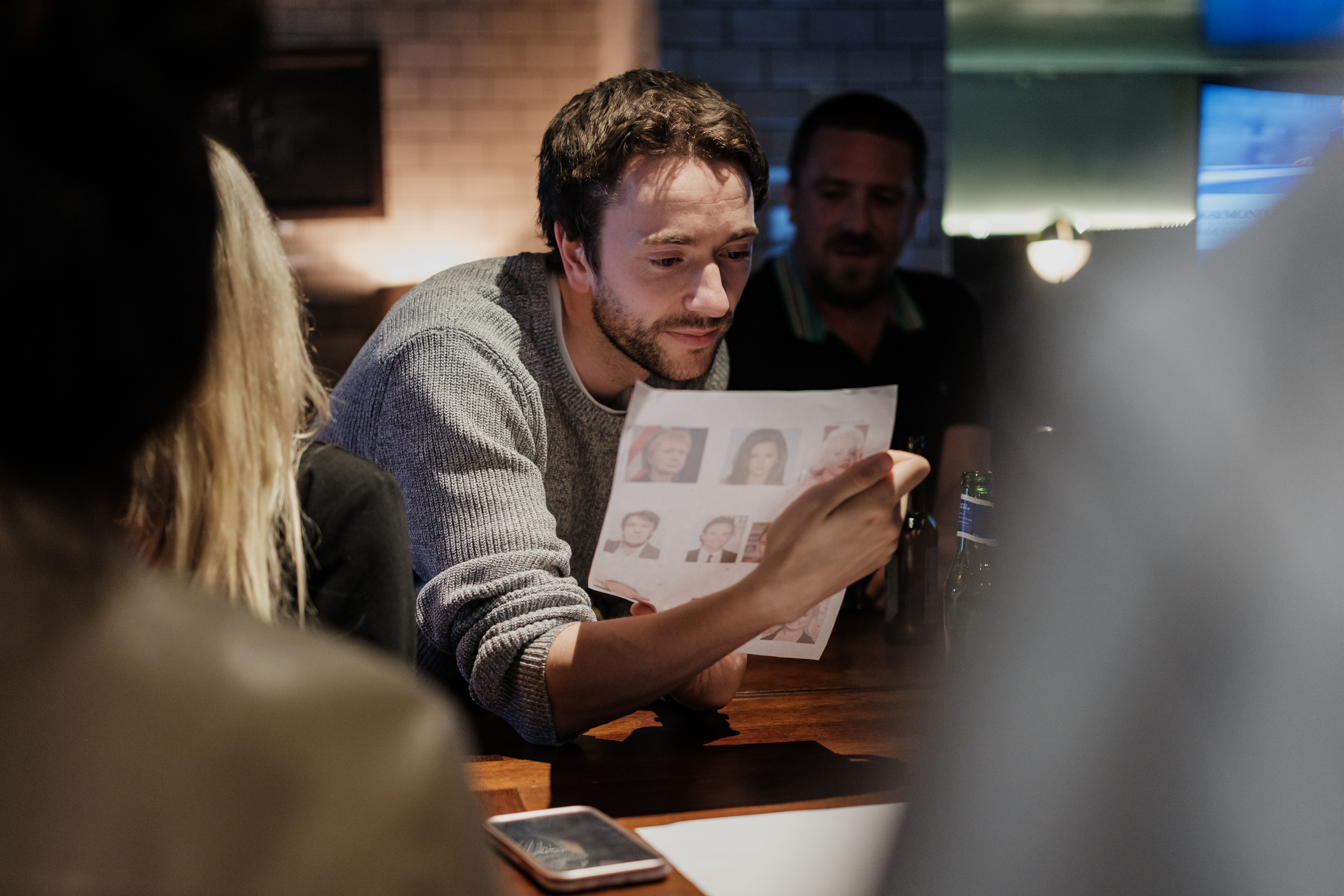 "Cellar Bar meeting space with engaged participants in a creative brainstorming session."