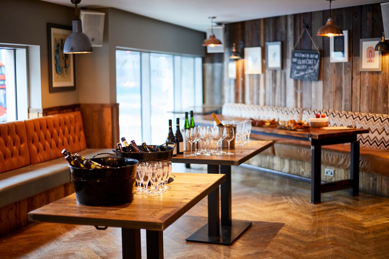 Stylish event space with wooden accents, ideal for intimate gatherings and networking.