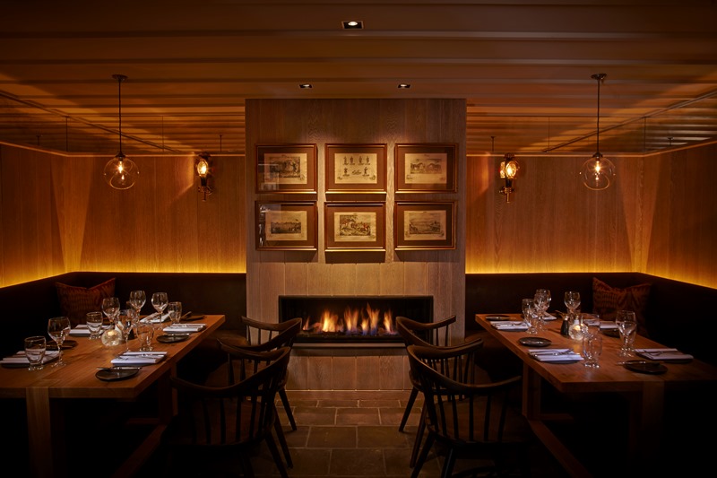 Intimate dining space at The Tack Room, warm wood tones, ideal for private events.